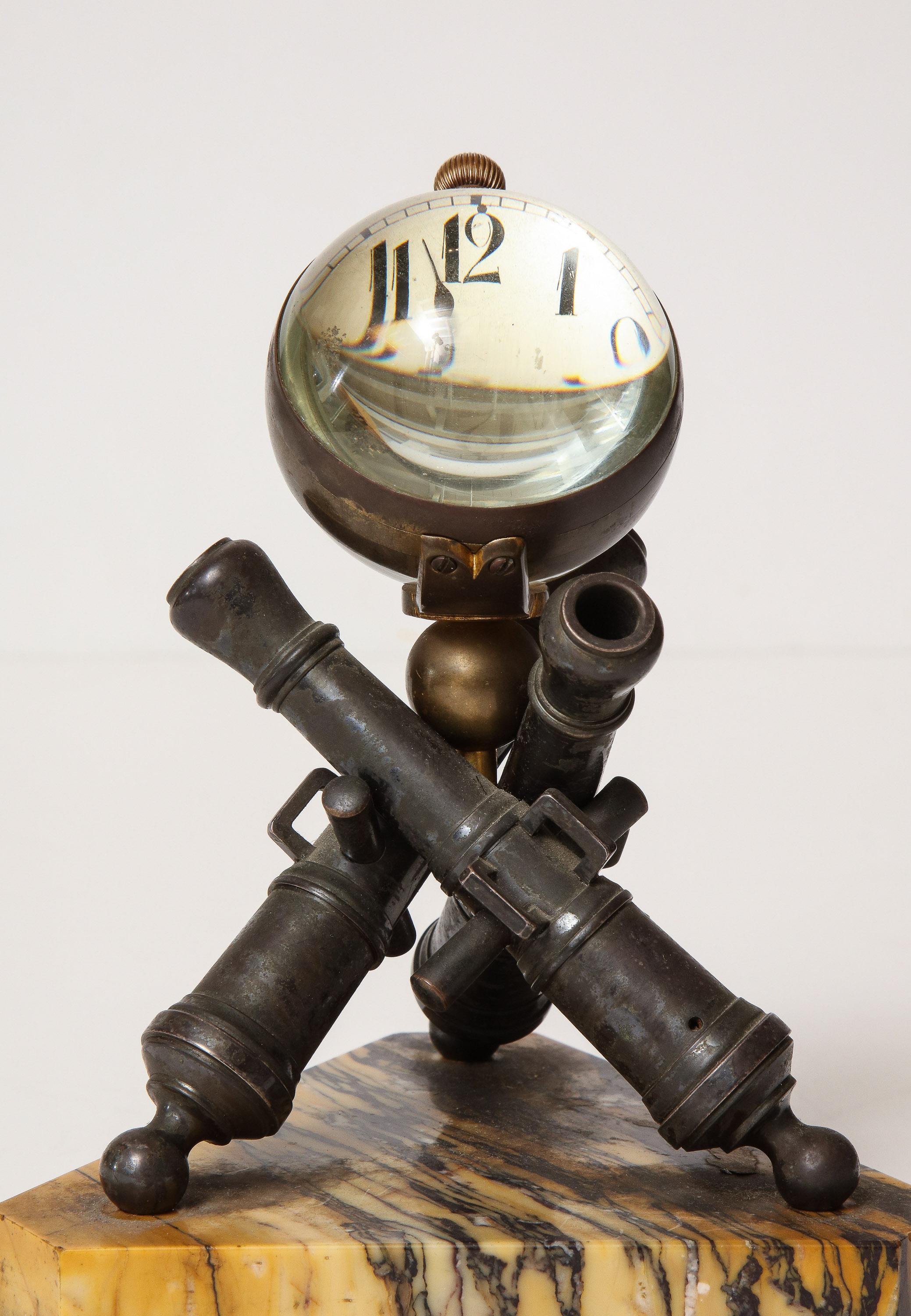 Late 19th century clock mounted on bronze cannons by W.C. Ball.