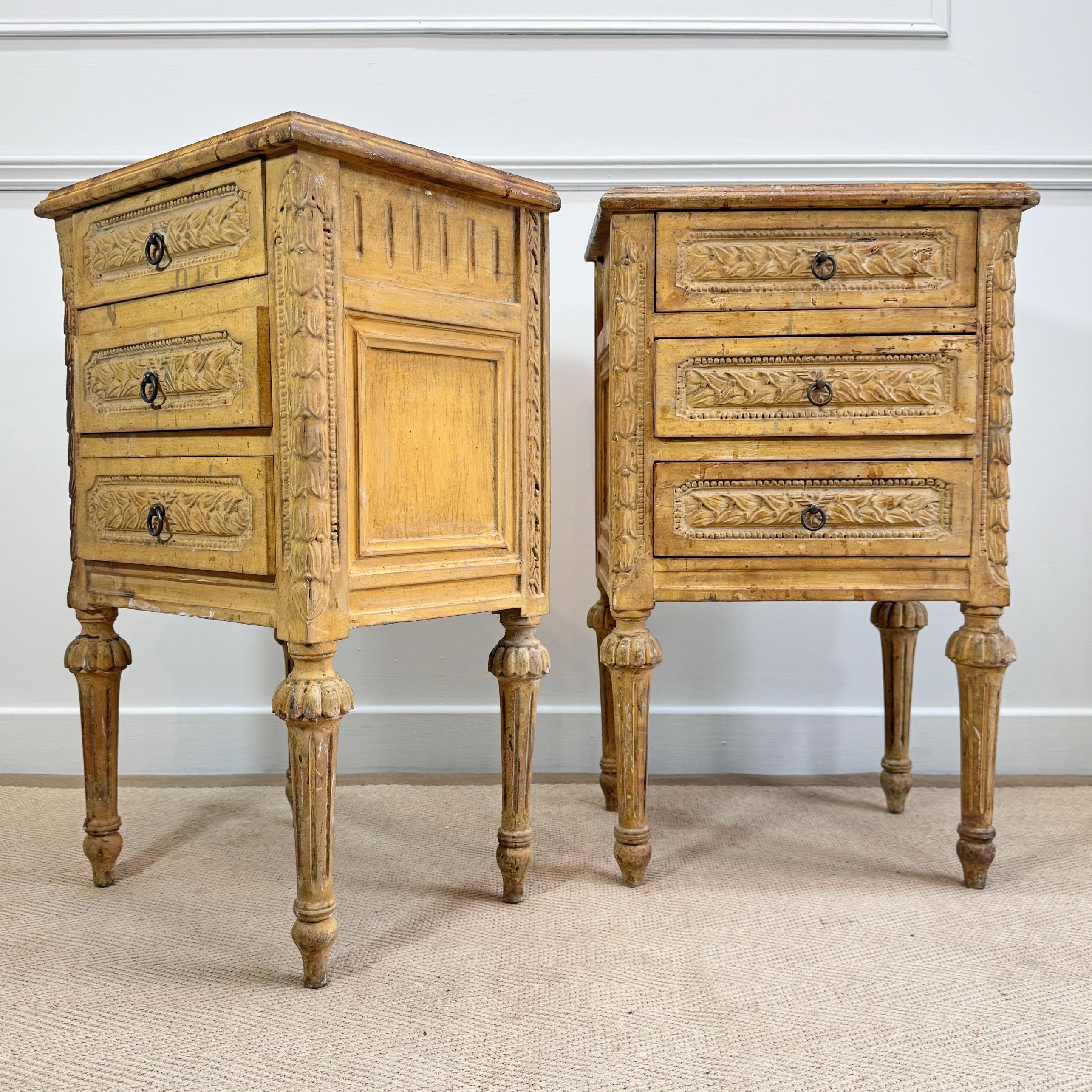 This decorative pair of late 19th century continental bedsides show beautifully carved details and rustic charm



Each cabinet features 3 equally proportioned drawers, exceptionally carved with a laurel leaf design, border and brass ring
