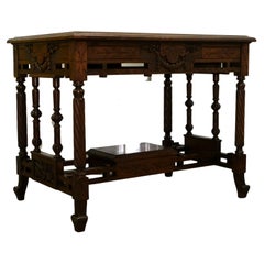 Late 19th Century Continental Carved Walnut Writing Table on Leather Inset Top