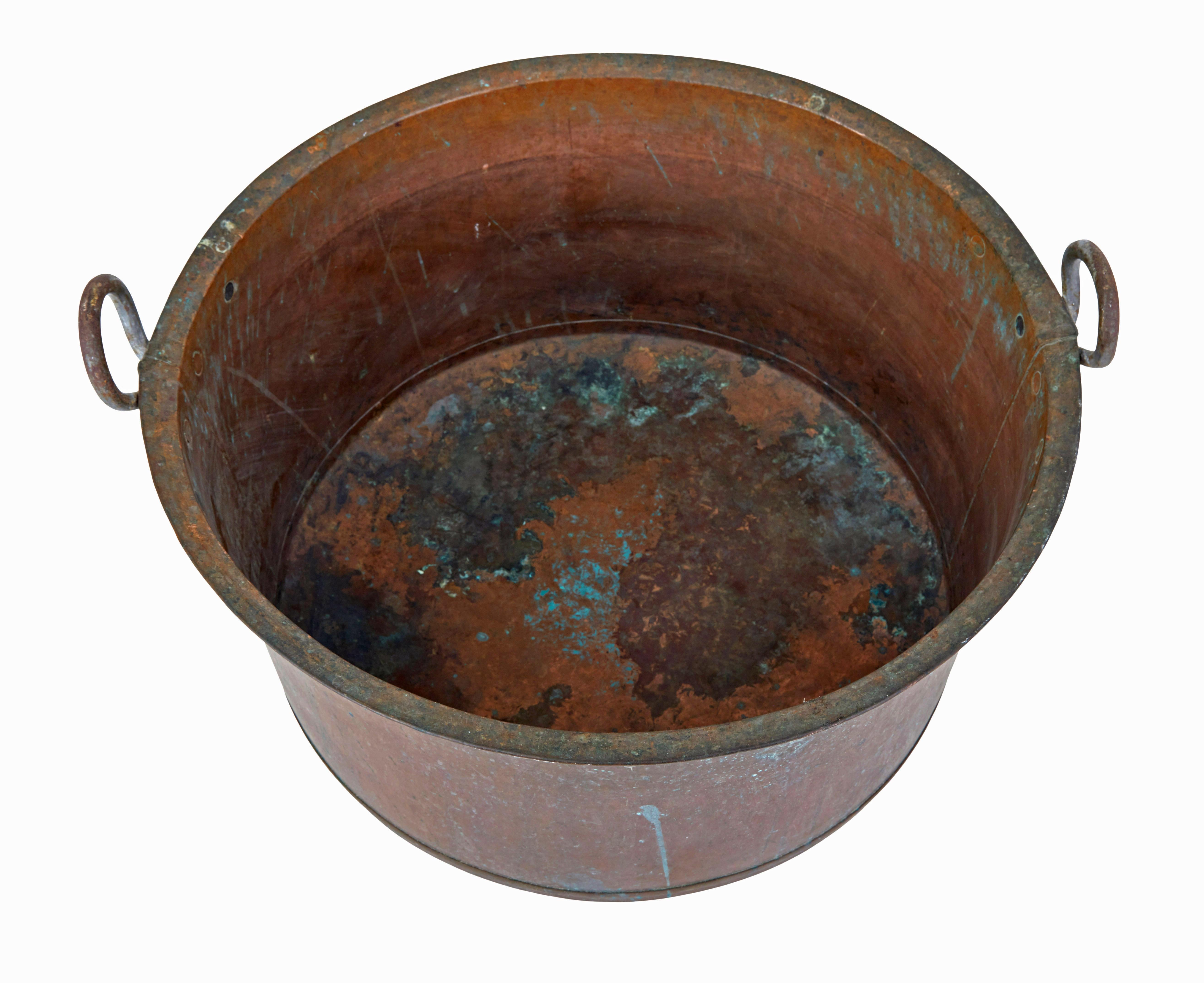 Late 19th century copper cooking vessel circa 1890.

Good quality piece of 19th century metalware, this large cooking vessel now provides the ideal fireside storage for logs or kindling.

Made from copper with applied looped handles.

Desirable and