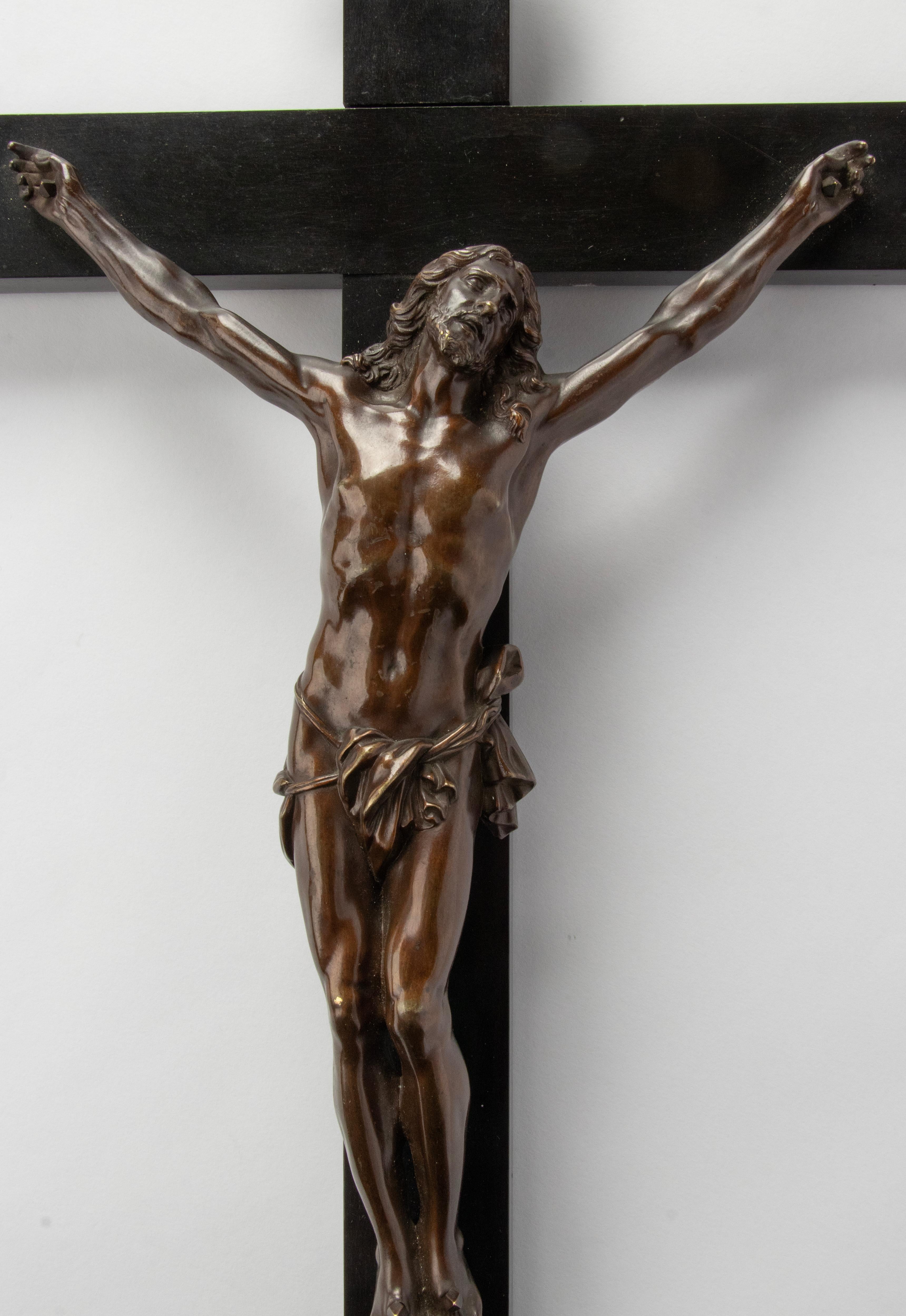 A fine brown patinated bronze crucifix 