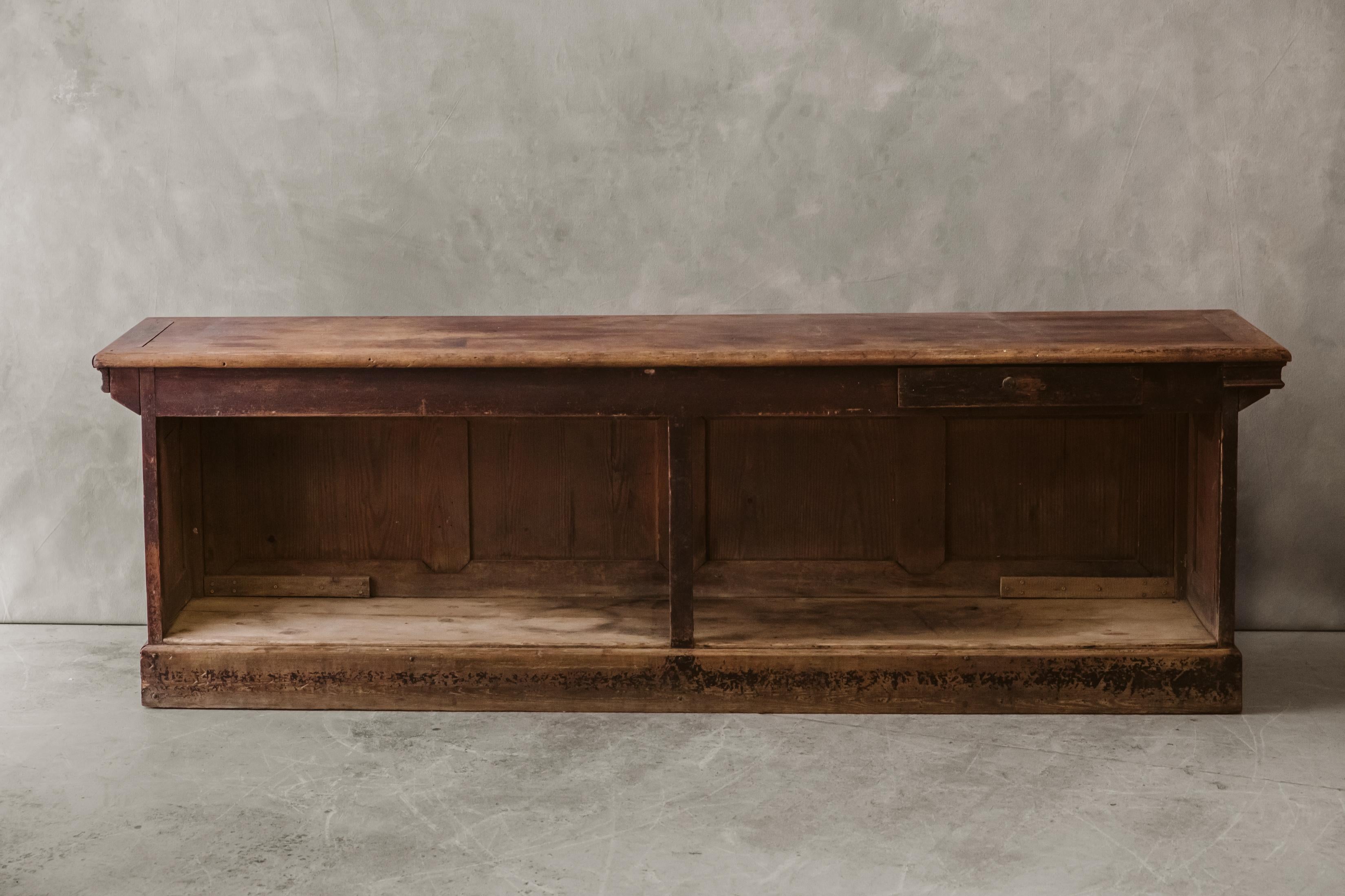 Late 19th Century Counter From France, Circa 1890.  Solid pine construction with fantastic original paint.  

We don't have the time to write an extensive description on each of our pieces. We prefer to speak directly with our clients.  So, If you