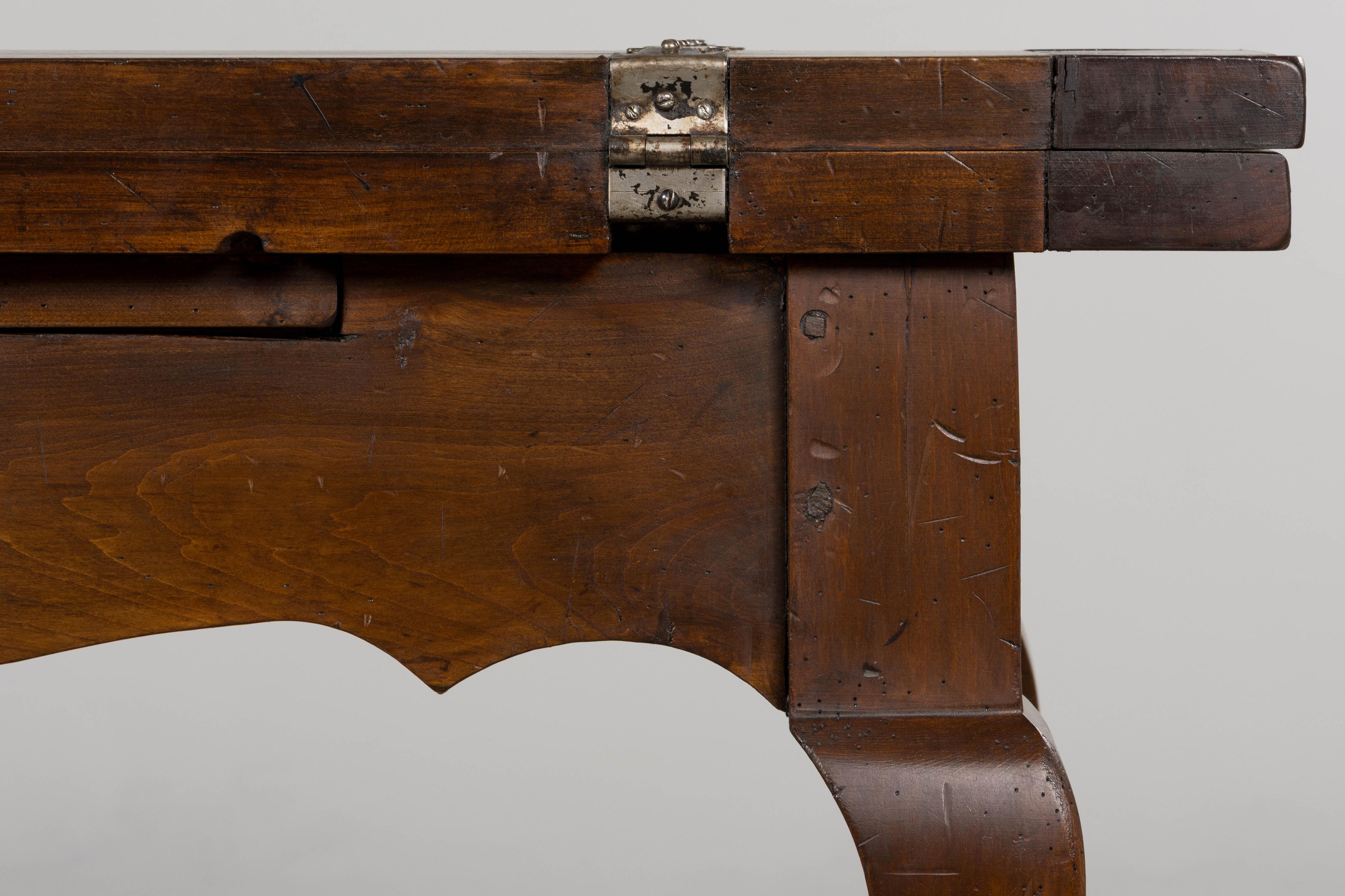 A 19th century French Provincial folding farmhouse table in solid maple, sourced in Provence, France. The piece has been structurally restored and refinished in our workshop, ensuring stability for daily use while preserving the warm patina of age.