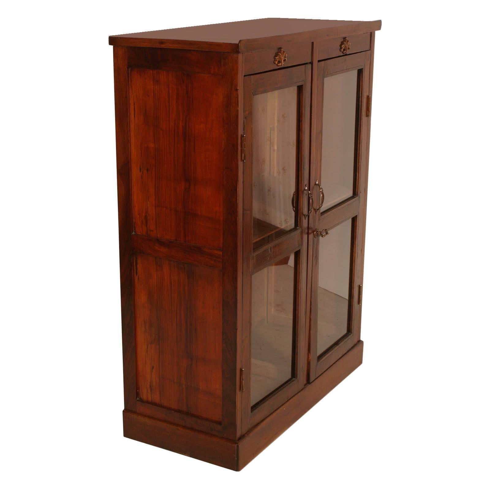 Late '800 display cabinet, buffet, in walnut. With two glass doors, large compartment with internal shelf and with secret with two compartments on the top that can be opened from the back. Cabinet restored and polished to wax in good conditions.