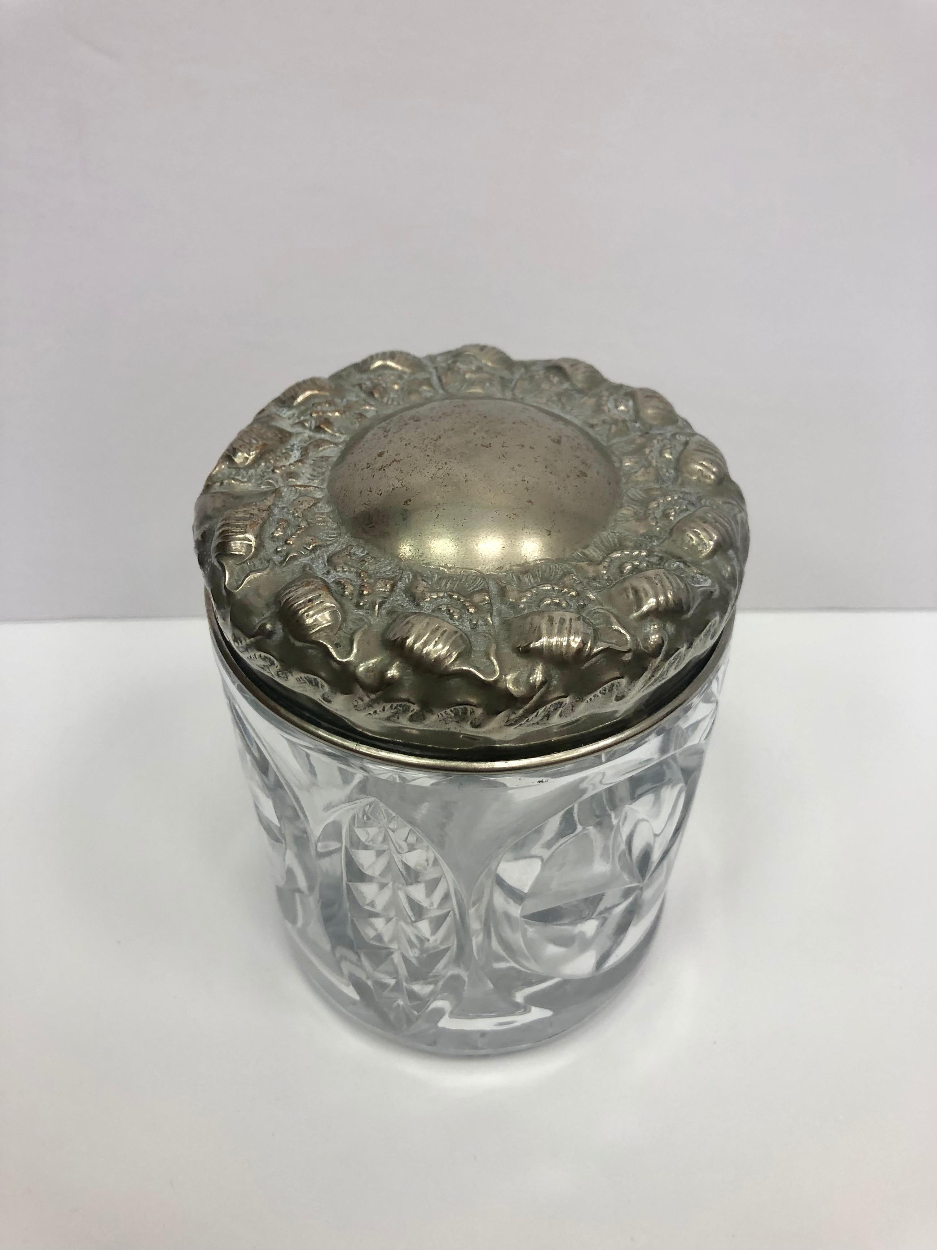 Beautiful antique crystal biscuit jar with a decorative silver lid. This is a nice size crystal jar with a removable decorative lid.