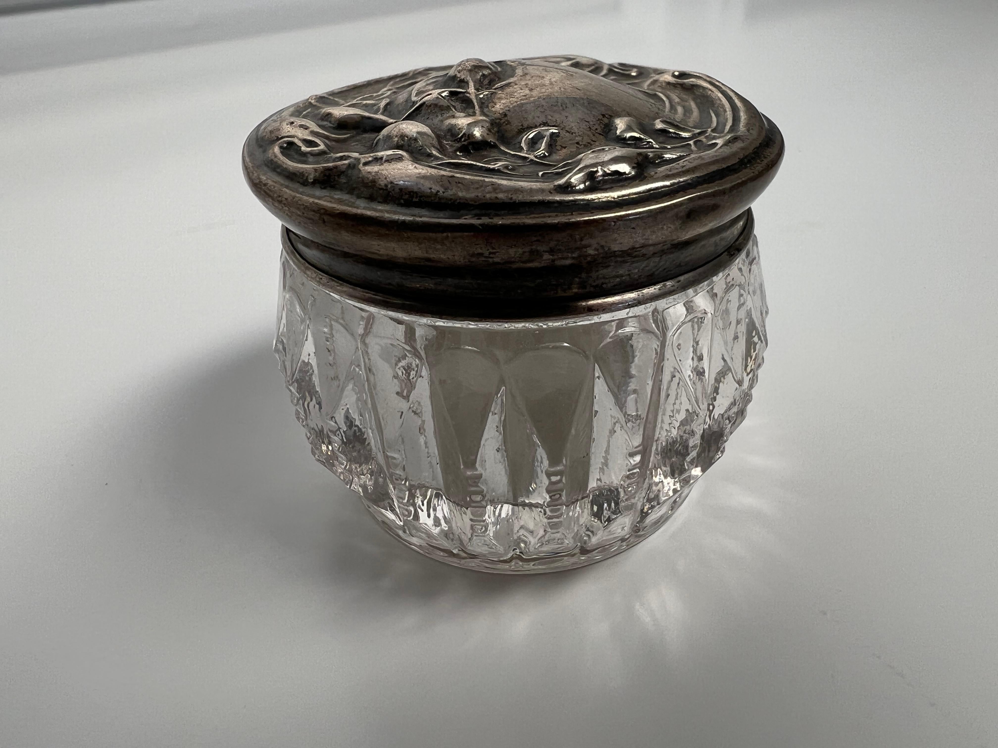 Late 20th century cut crystal dresser jar with zipper cut edge and a decorative sterling silver top. From a private collector who traveled the world buying beautiful items.