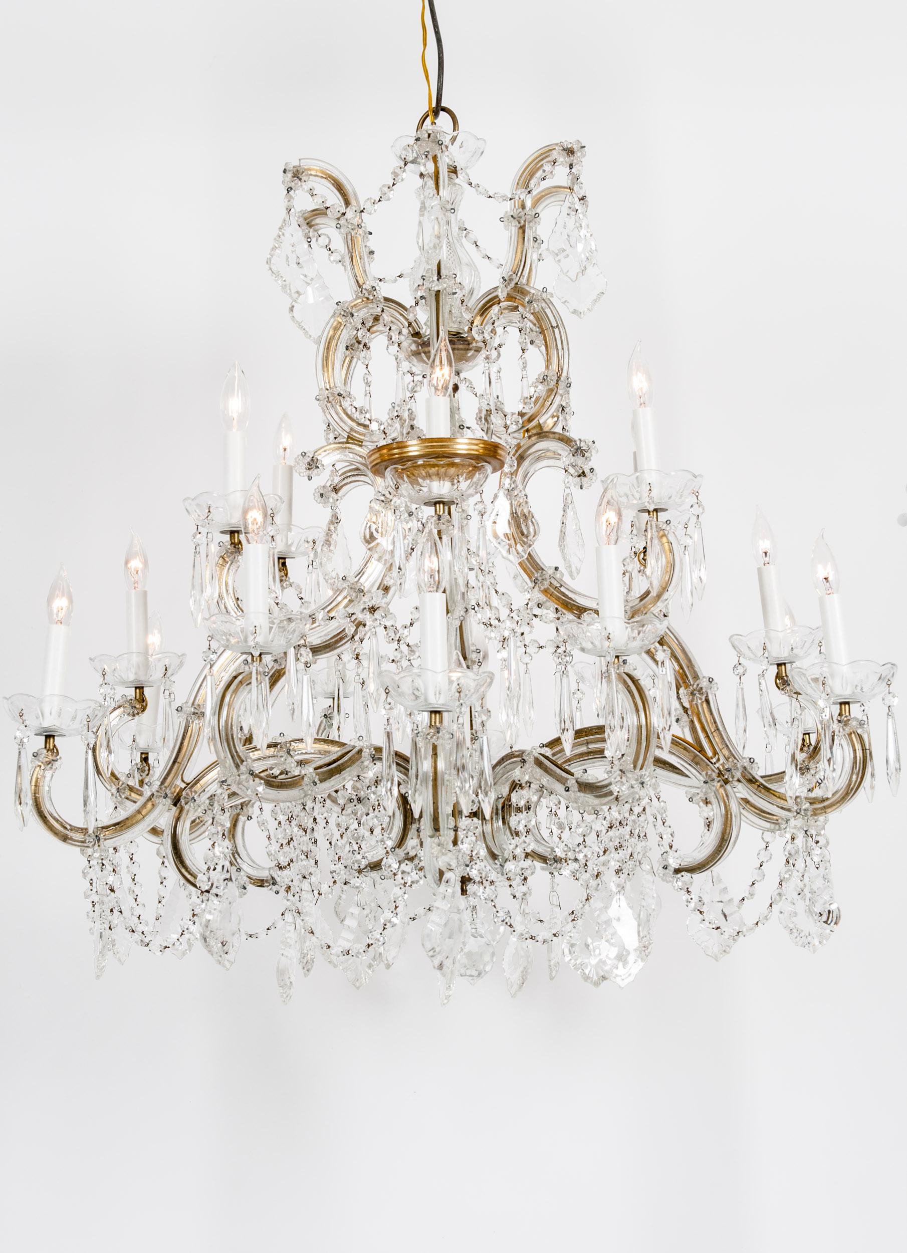 Late 19th century cut crystal 18-light North American hanging chandelier. The chandelier is in great working condition recently rewired. Minor wear consistent with age / use. The chandelier measure about 36 inches length X 38 inches diameter.