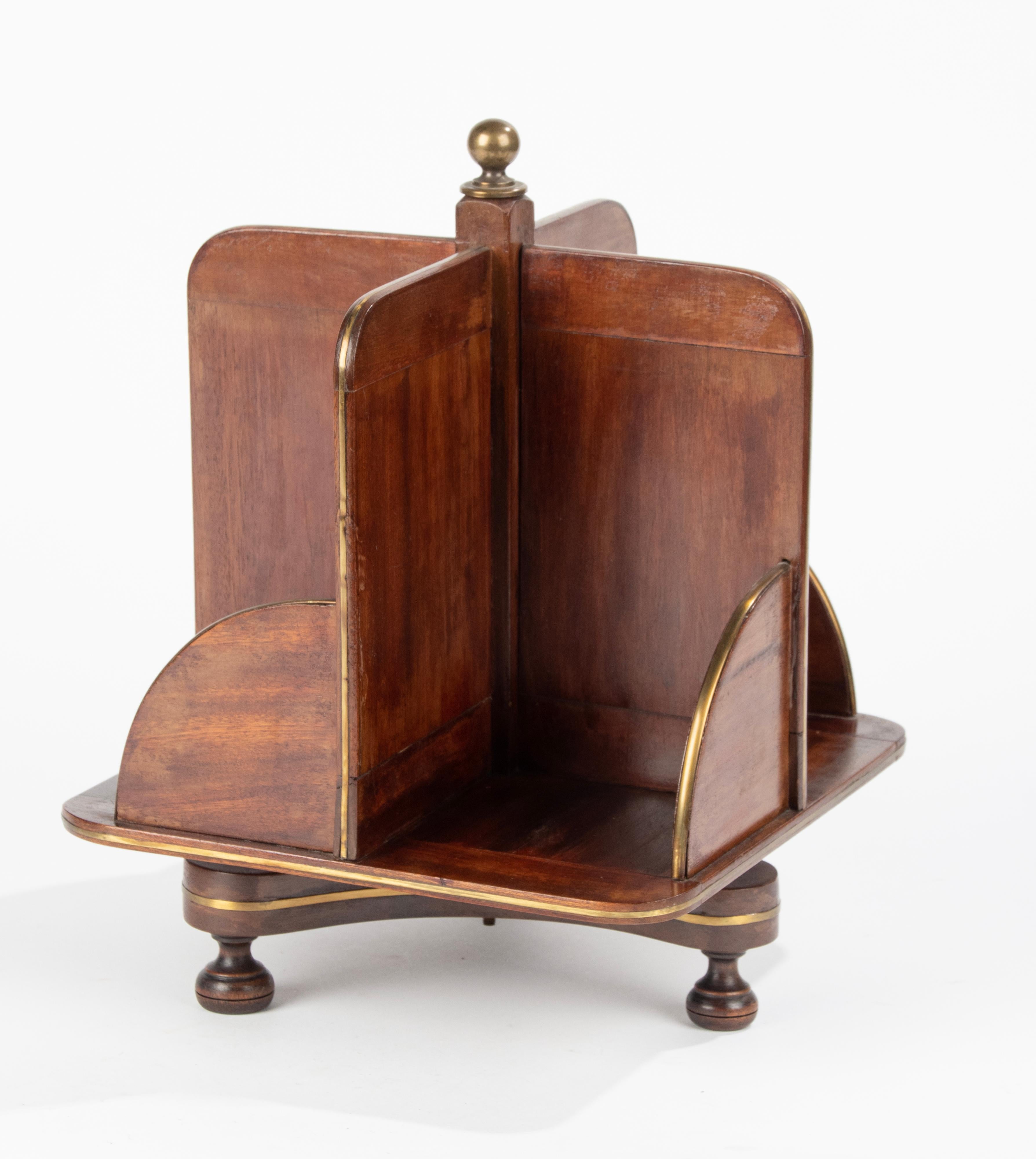 An antique rotating small book mill for your desk, including the small books. The book mill is made of mahogany wood with brass inlays. Including small books. Made in France circa 1870-1880