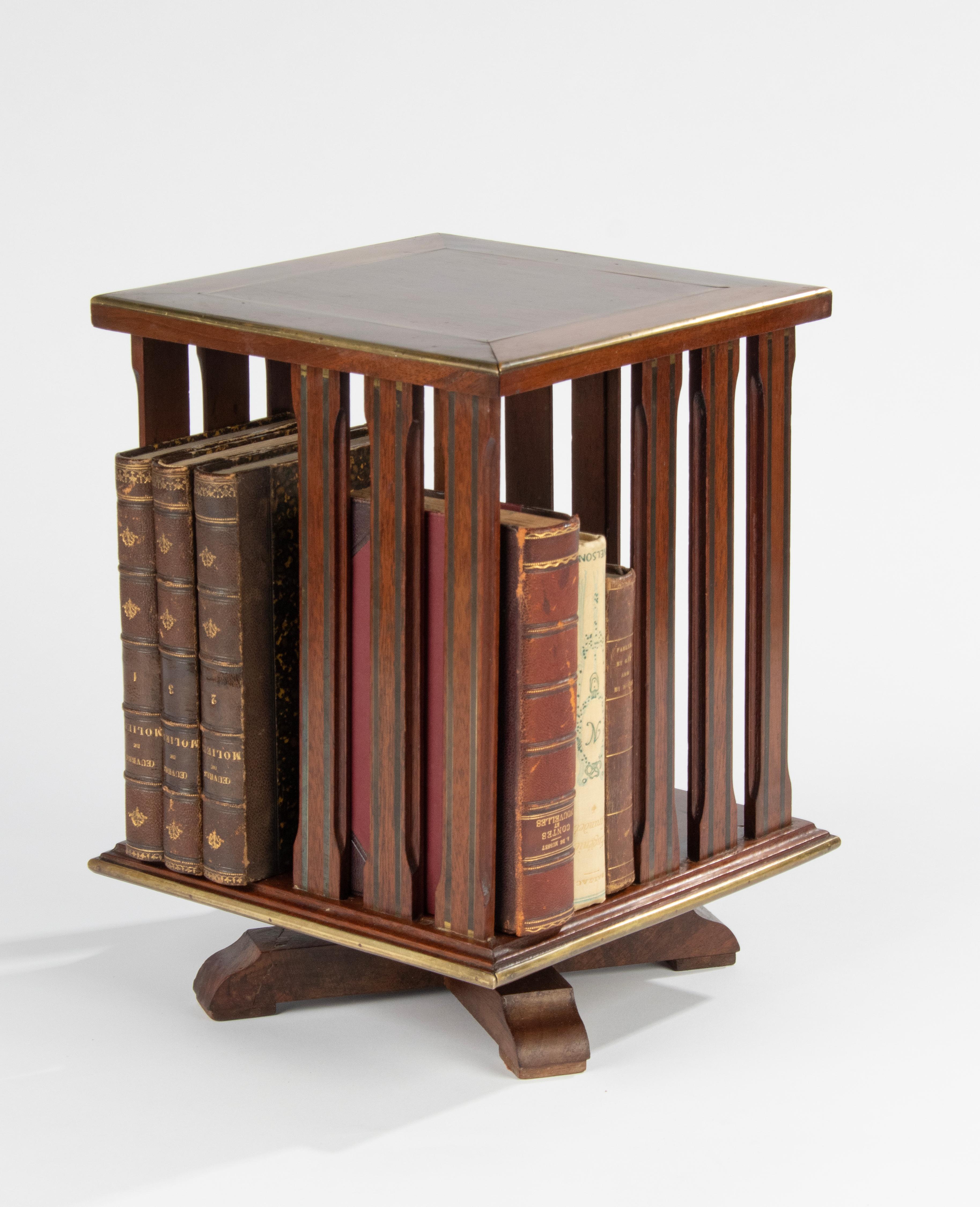 An antique compact book mill with rotating function. The bookmill is made of solid mahogany wood, inlaid with copper and zinc .It has four storage compartments. Made in France, around 1880-1890. Nice desk accessory.
Dimensions: 32 (h) x 24.5 x 24.5