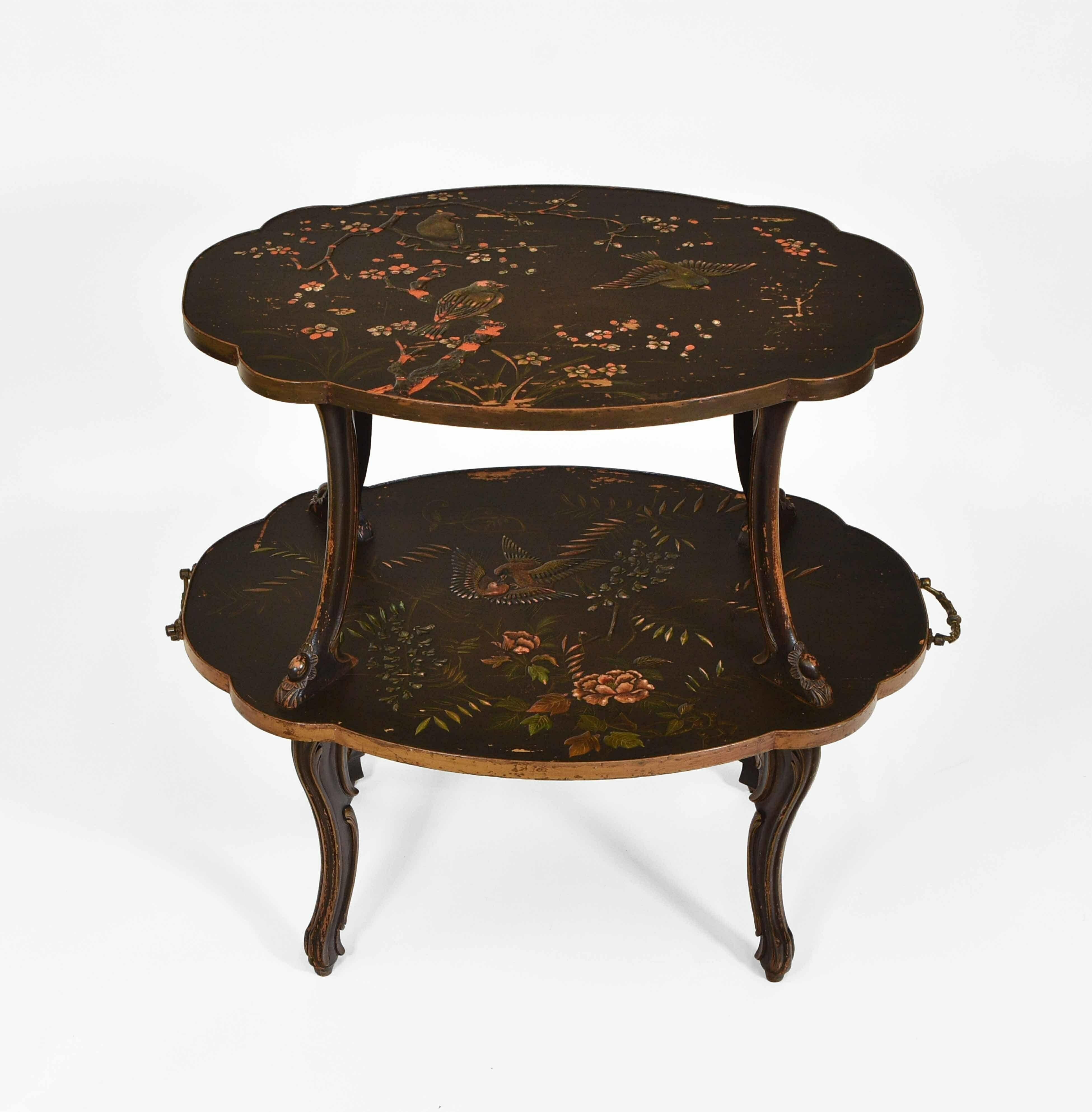 Late 19th century Dutch black & gilt japanned low etagere with ornate carrying handles.

Delivery is INCLUDED in the price for all areas in MAINLAND England & Wales.

The lobed table tops are ornately embellished with chinoiserie scenes