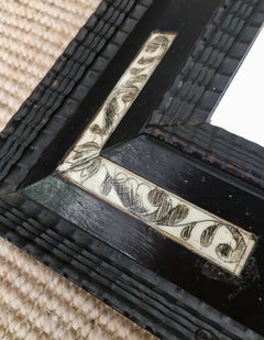 Late 19th century Dutch ebonised ripple frame style mirror