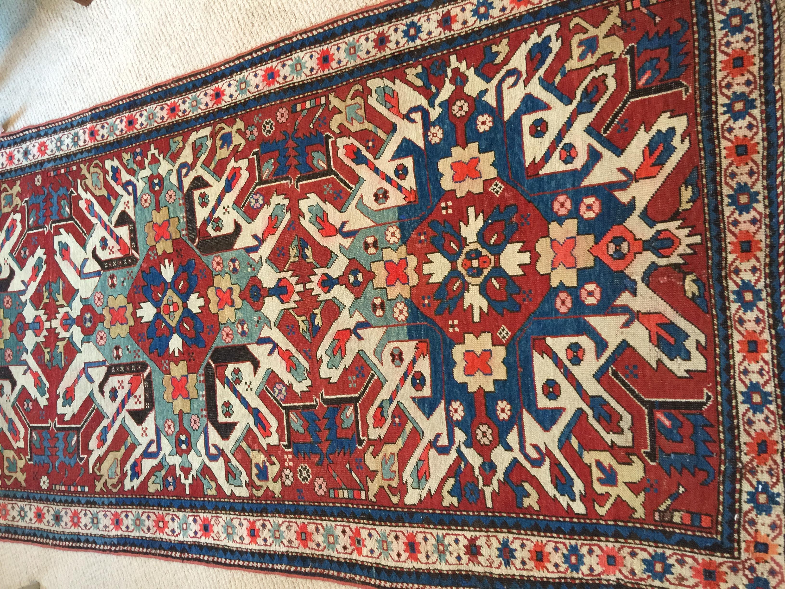 Beautiful late 19th century eagle Kazak Chelaberd wool carpet rug has wonderful colors and sunburst detailing. Wool, hand-knotted, vegetable dye colors and many interesting details, circa 1870. Sole collector proprietor acquired in the 1970s in Iran