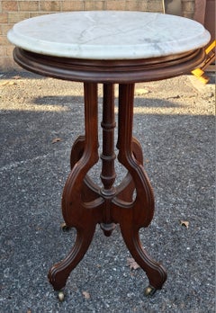 Late 19th Century Eastlake Style Walnut and Marble Tip Oval Rolling Side Table