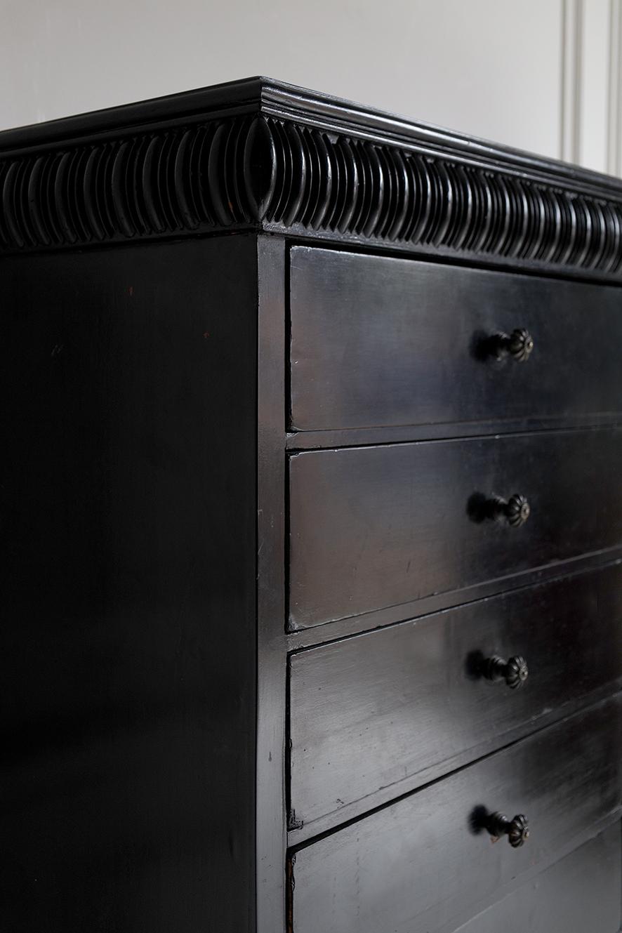Ebonised chest of drawers with sixteen drawers with a decorative frieze from circa 1880.

