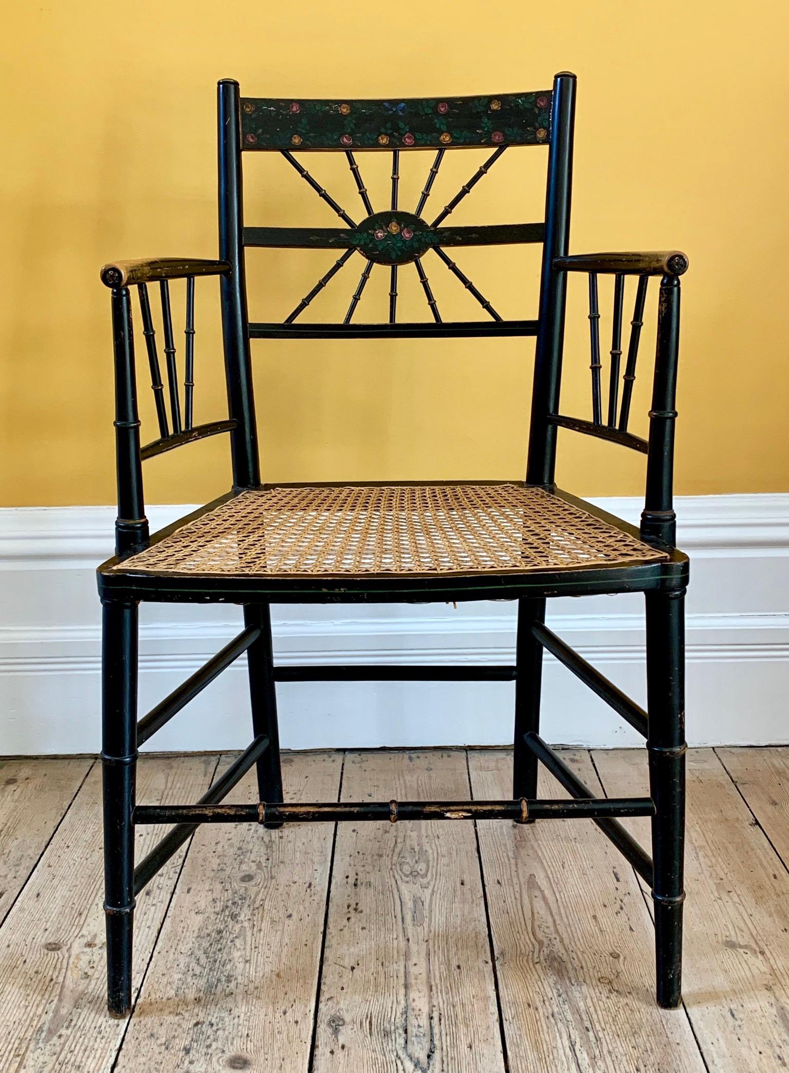 Hand-Crafted Late 19th Century Ebonized Sussex Chair with Cane Seat and Painted Detail For Sale