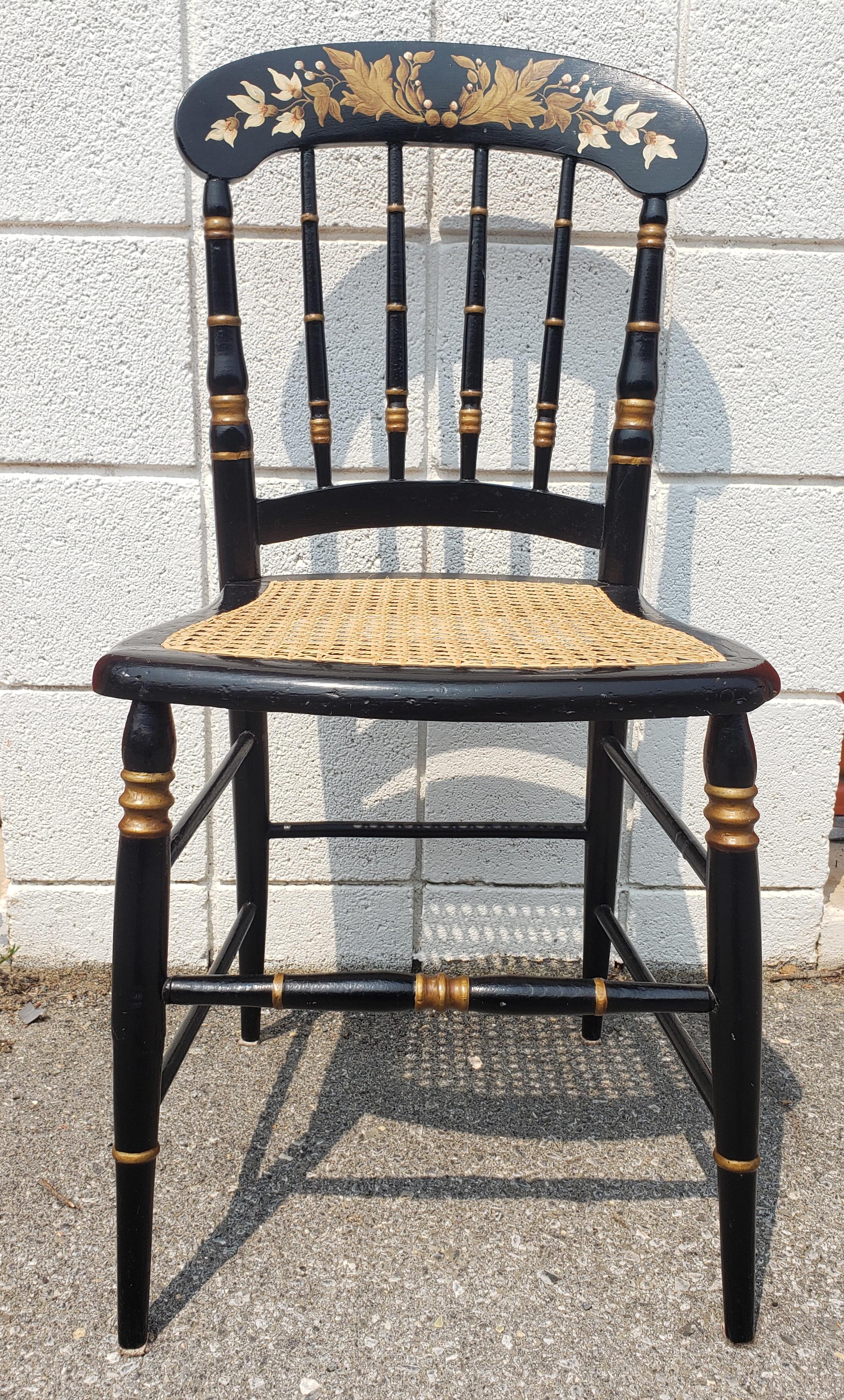 A completely refinished Late 19th century Ebonized and Parcel Gilt and hand decorated Cane Seat Side Chair.
Very sturdy and will last the next few decades.