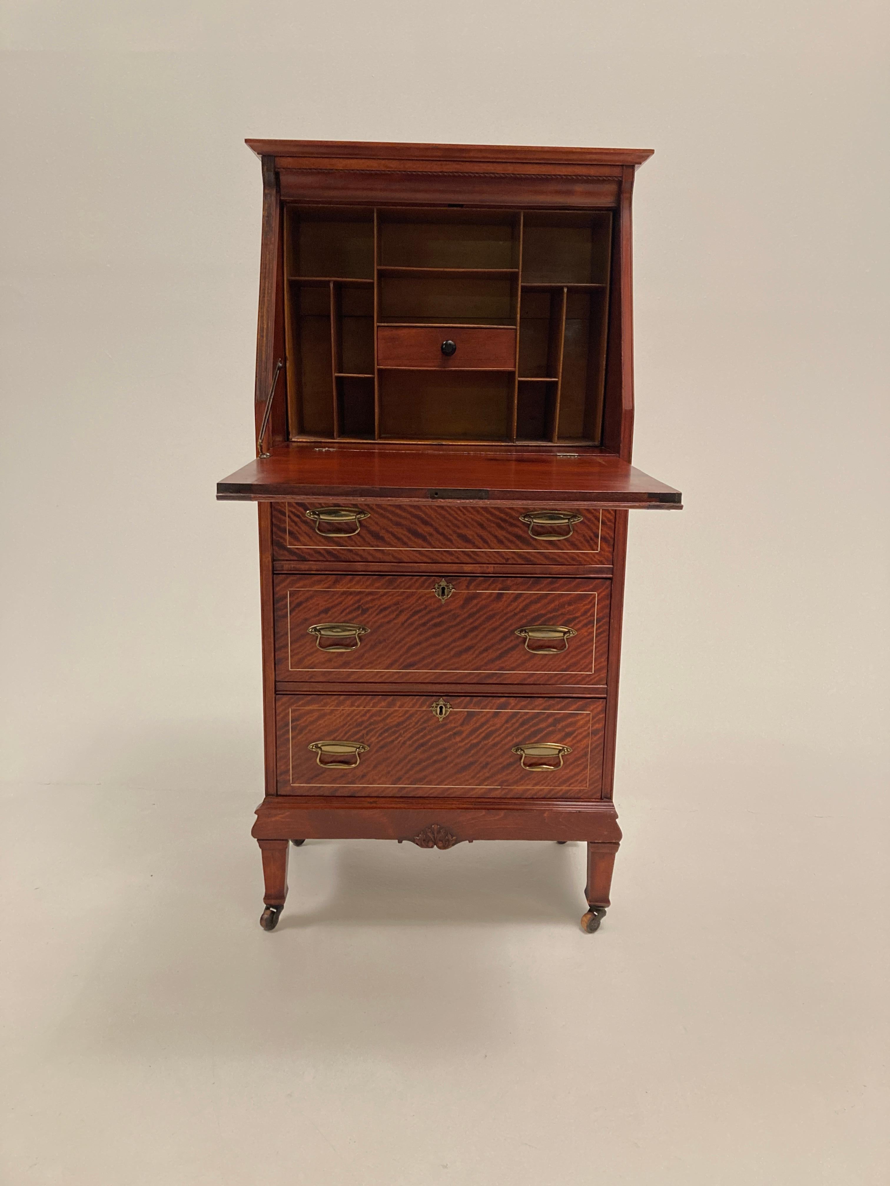 This late 19th, early 20th Century Edwardian Style, Crotch Mahogany woman's drop front desk is so beautifully unique and perfectly petite to fit in so many compact room-scapes! The figuration of the crotch mahogany is stunning, drawing attention to