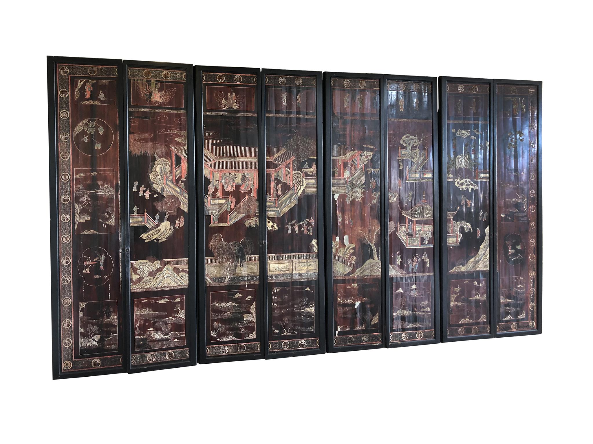 An exquisite late 19th century Chinese screen. It is comprised of eight individual hand painted panels with lacquered coromandel. The panels' design is expertly rendered in intaglio and painted in with enamel. What unfolds on these panels is a
