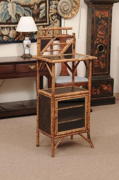 Late 19th Century English Bamboo Cabinet with Black Lacquered Detail and Foliage