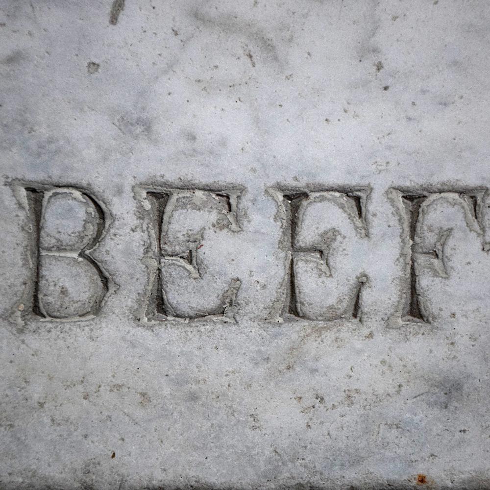 Late 19th Century English Carrara marble butchers’ slab. 

A rare example of a late 19th Century Carrara marble engraved English butchers trade slab. Depicting a cow and sheep, with text beneath. A naturally aged item that would likely have been