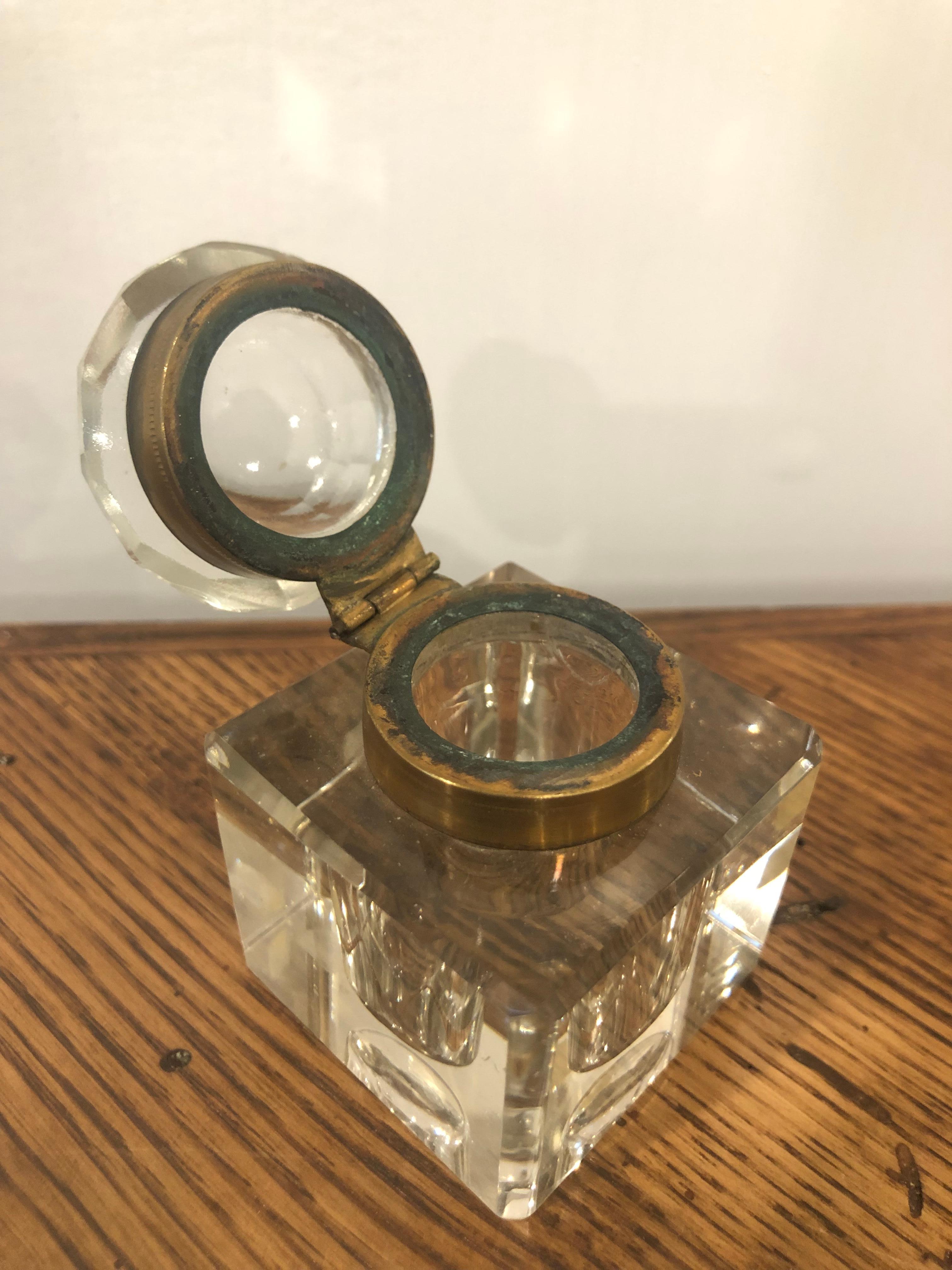 Late 19th Century crystal inkwell with a brass collar and chamfered edges, English circa 1880. This is one of many pieces we received from a private collector who traveled the world buying beautiful pieces.