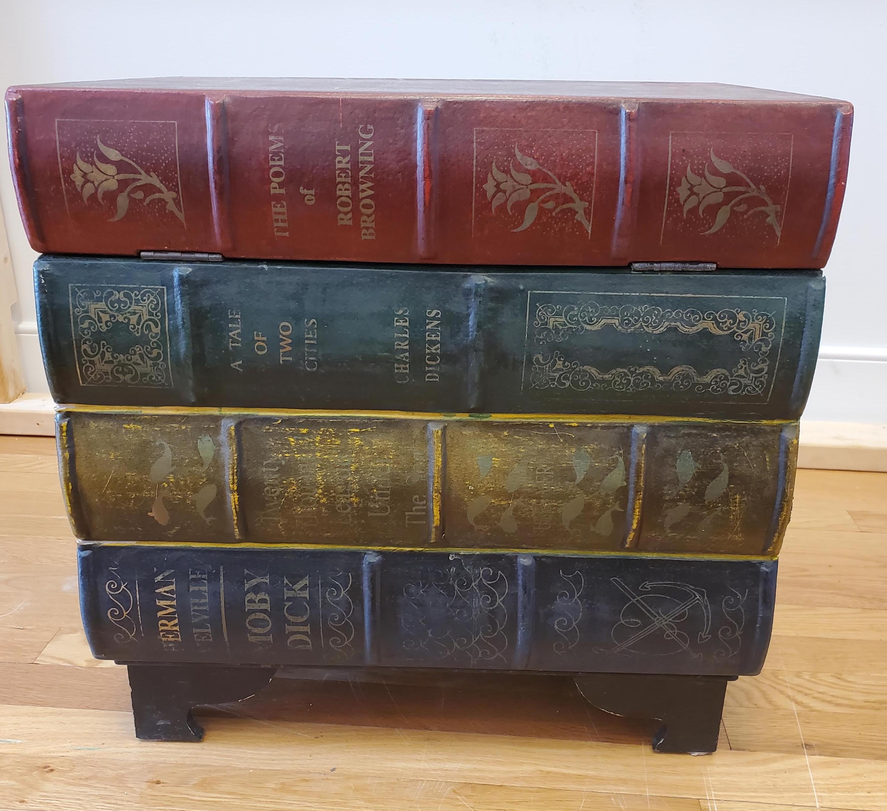 Late 19th century English leather faux “Book” table. A simulated stack of leather books with English classical titles “Moby Dick”, “Tale of Two Cities”, 