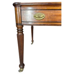 Late 19th Century English Leather Top Writing Table with Flouted Legs.