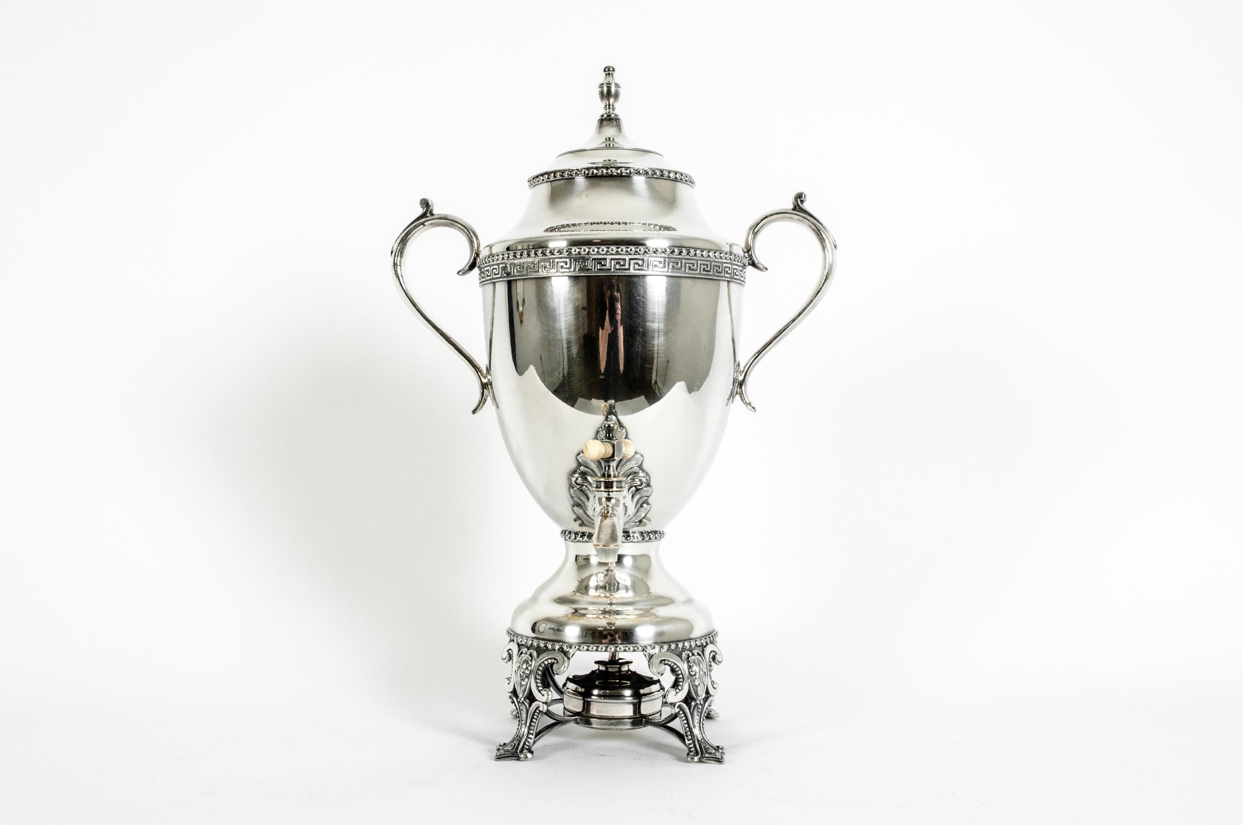 Late 19th century English silver plated footed hot water samovar with exterior design details and flame burner. The samovar is in excellent antique condition. Minor wear consistent with age / use. Maker's mark undersigned and numbered. Covered the