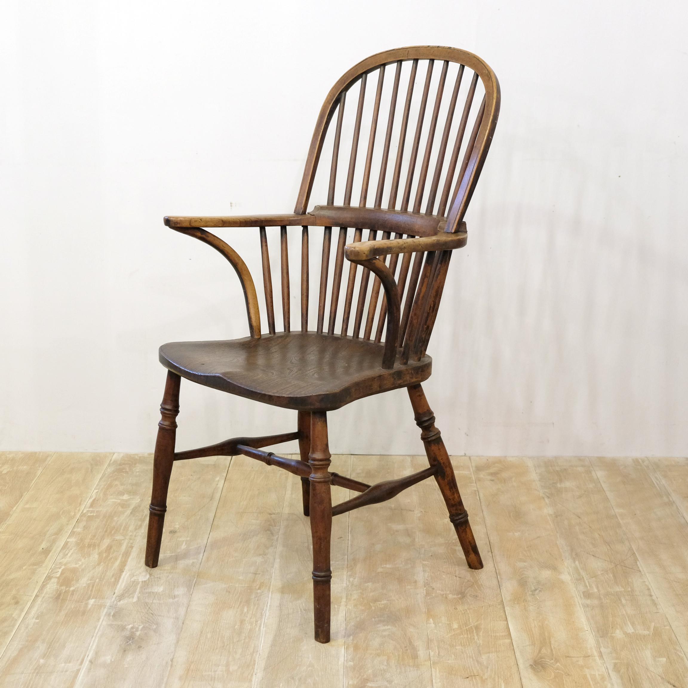 Well formed and aesthetically pleasing late 19th century English made Windsor chair, likely Thames Valley in origin. Ash and elm with turned legs and stretchers, out-splayed arms, curved supports and simple stick back. Pleasing color, not over