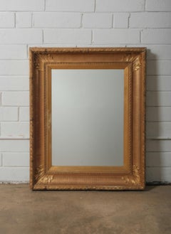 Late 19th Century European Hand-Carved Wooden Mirror with Ornate Foliate Frame
