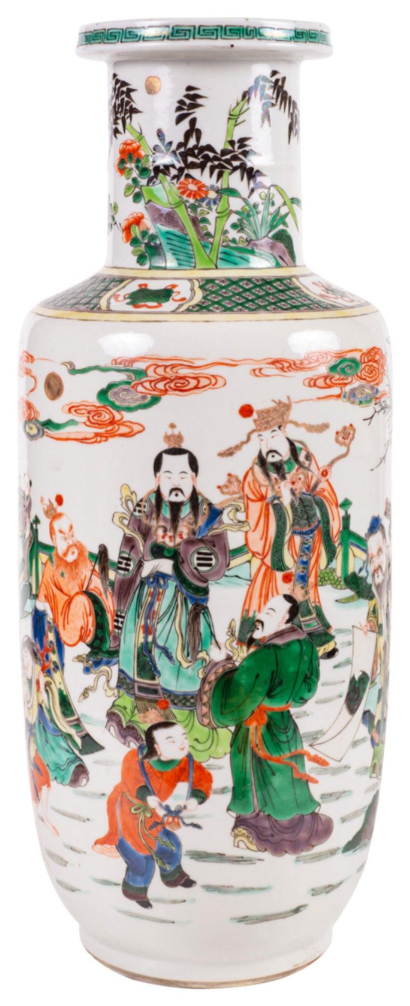 A very good quality late 19th century Chinese Famille verte Kangxi style Rouleau vase, having a green ground with classical Chinese courtiers, scholars and children playing in the gardens.