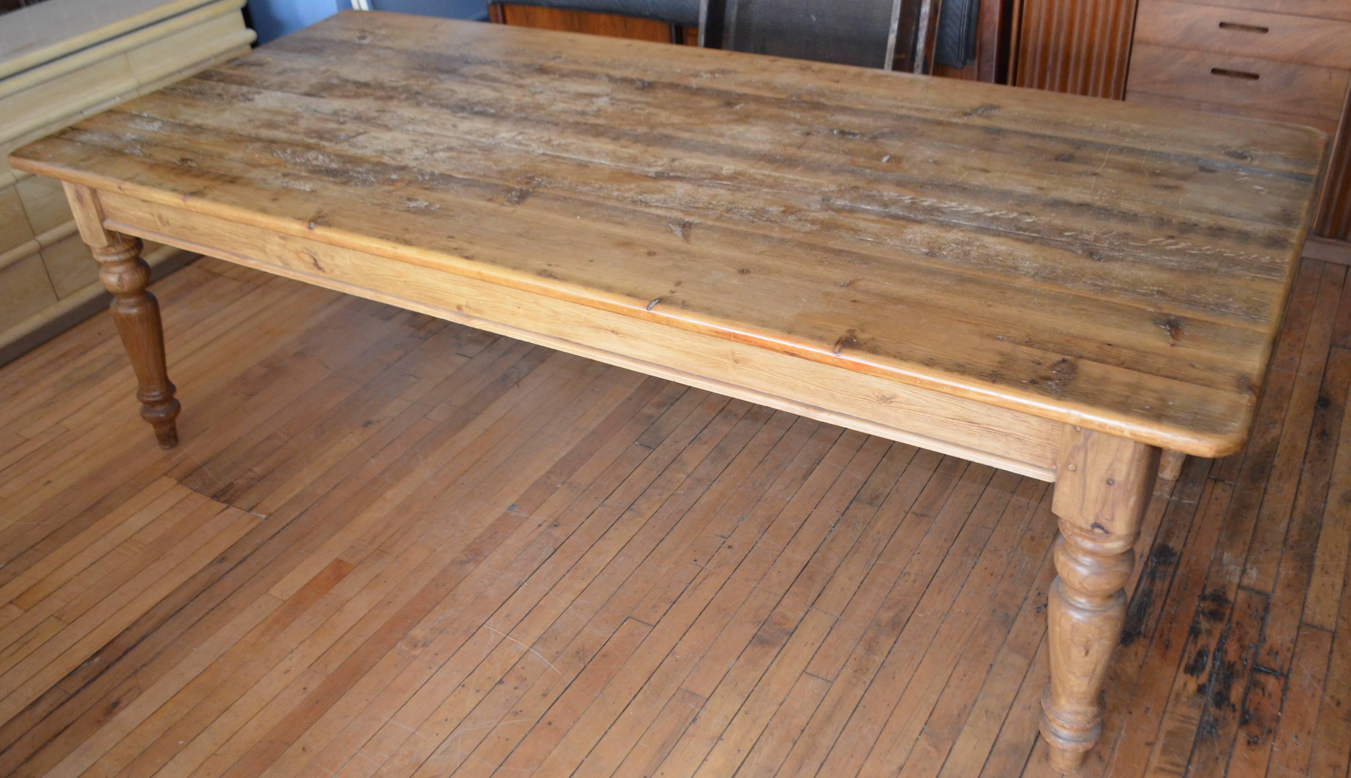 Farm table of pine with balustrade legs, circa 1890. Amazingly solid, sturdy with 8-foot length and a deep, expansive width of 43 inches. Pine board top has a rich patina of character and use. Several generations of a farm family sitting down to