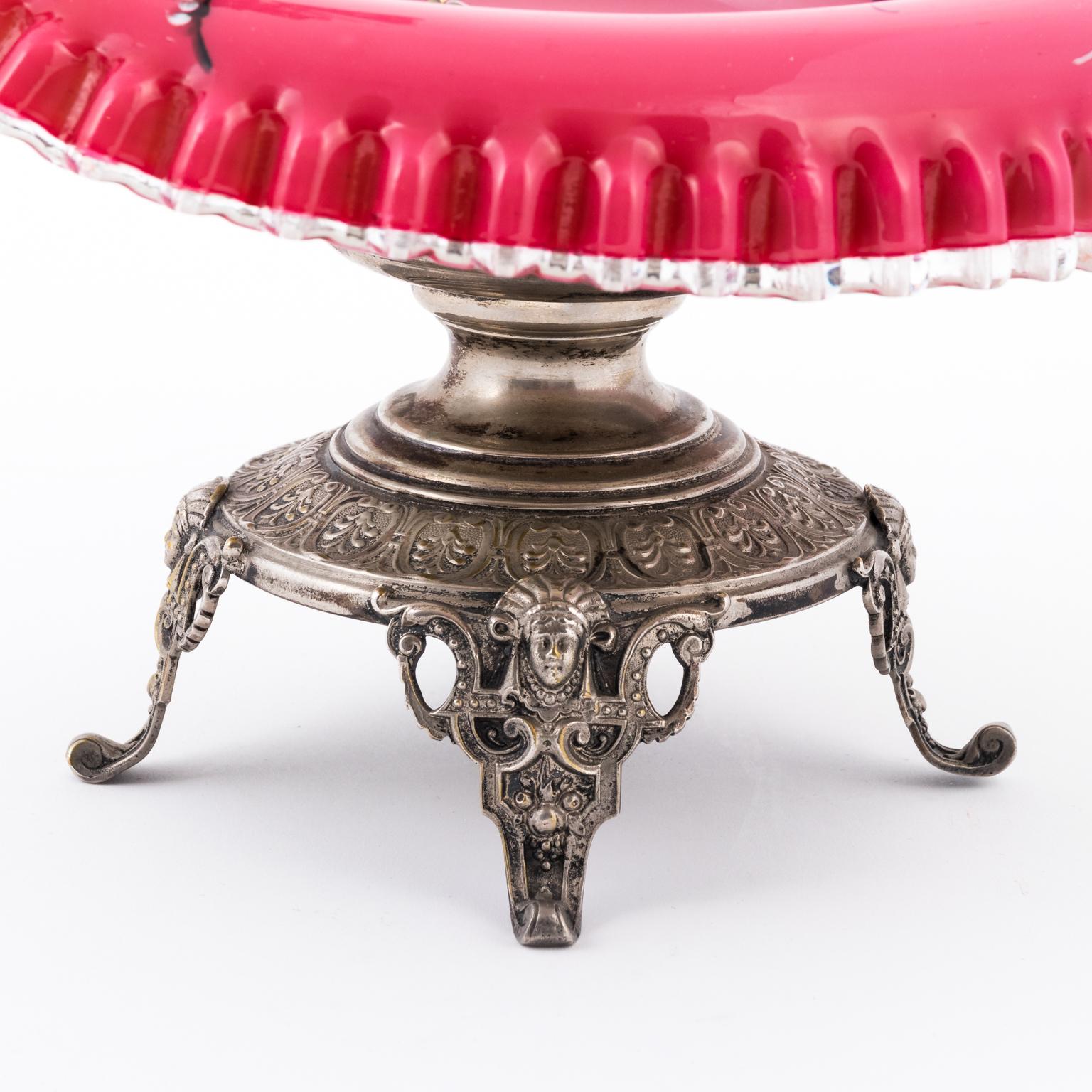 Figural Squirrel bride's basket with pink encased hand painted art glass bowl attached to a silver plate frame featuring figural squirrel and Egyptian Revival faces on feet, circa 1886 Germany.