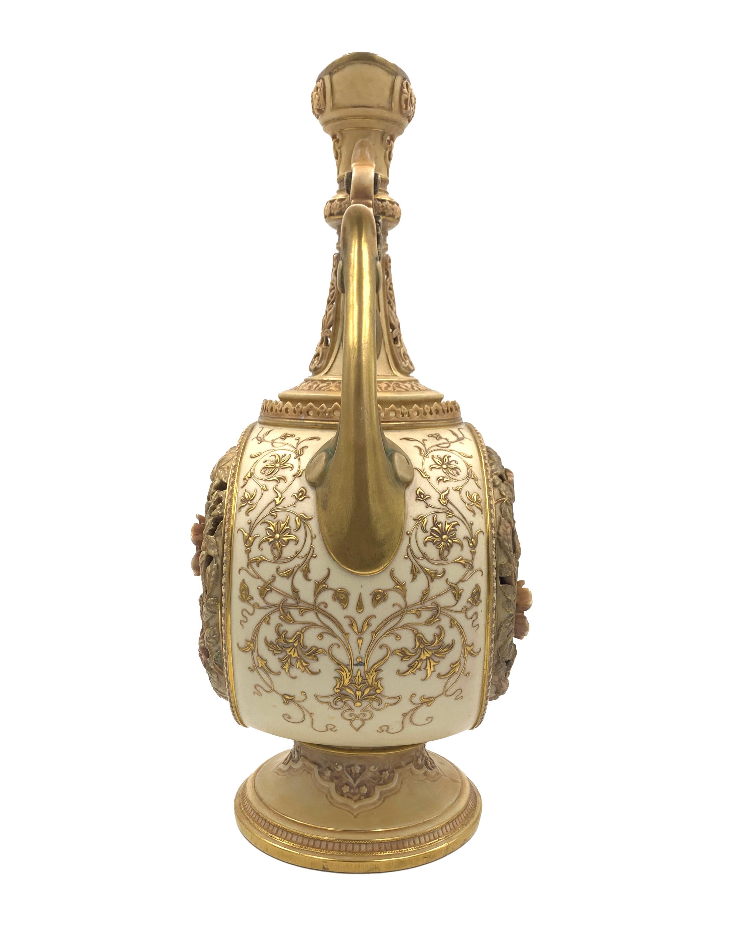 A fine late 19th century vase in floral design, headed handles and strong gilt decoration from the sides.
 