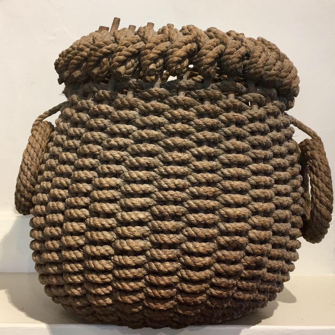 Late 19th century Fisherman's Rope Woven Eel Basket, circa 1890, a rare hand woven basket apparently unique to the New Jersey coast, with a coarse rope weave on twig staves, with solid wooden bottom, and rope becket handles. These baskets were used