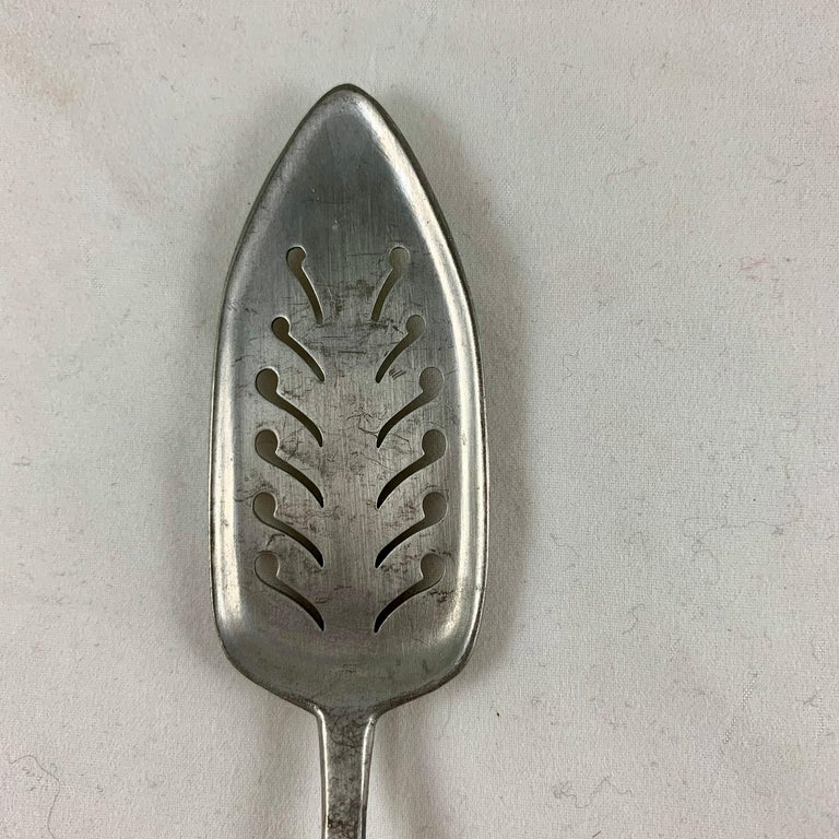 Late 19th Century French Absinthe Slotted Metal Sugar Spoons, a mixed