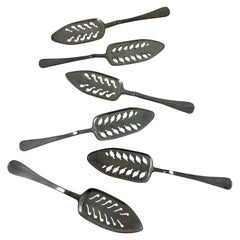Late 19th Century French Absinthe Slotted Metal Sugar Spoons, a mixed set of six