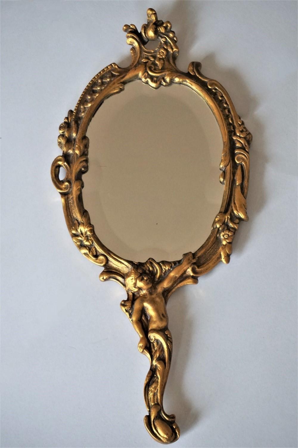 Art Nouveau period gilt bronze faceted nostalgia hand mirror with ornate detailing and arched top, beautiful handle with figure. France, circa 1890.
Measures:
Height 13 in (33 cm)
width 5.75 in (14.5 cm)
Mirror glass only: H 5.75 in / W 4.25 in