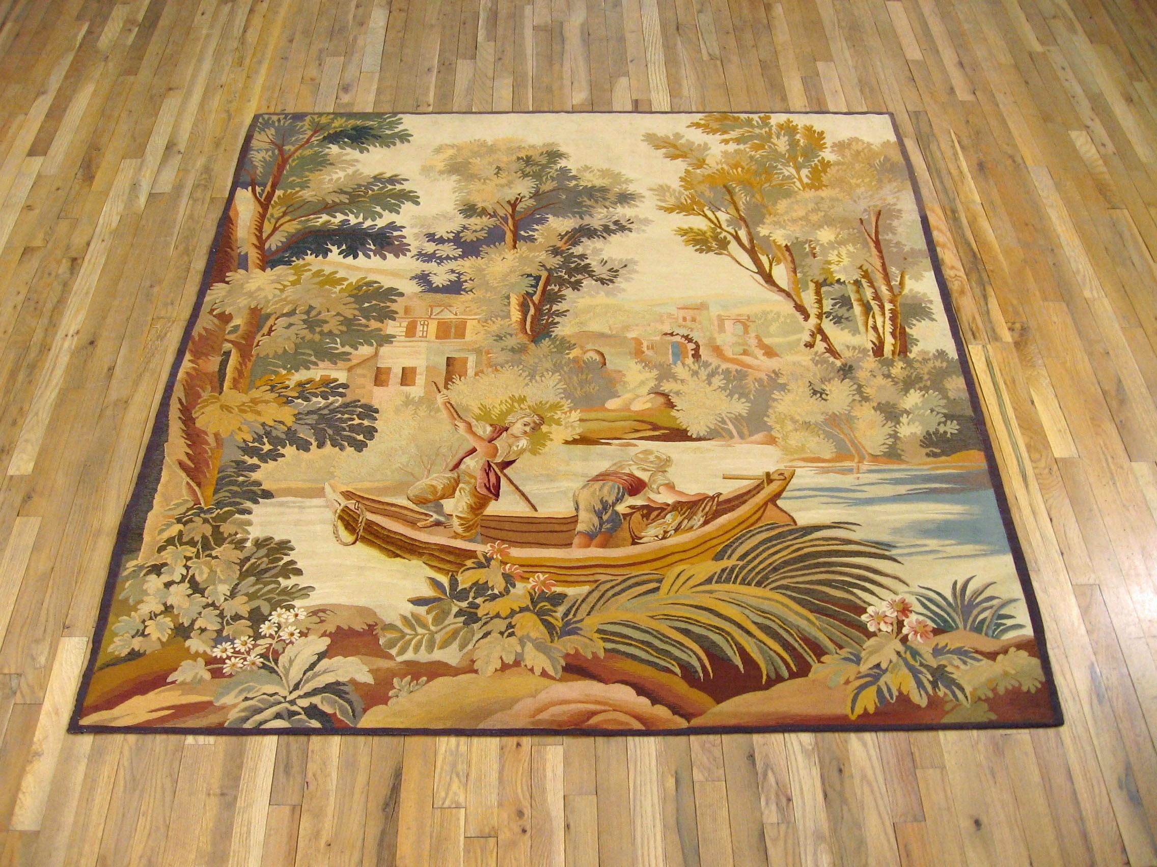 A French rustic Aubusson tapestry from the late 19th century, featuring a fishing scene with two young men on a stream in a small boat, with one rowing and the other gathering the catch, as they pass through a picturesque landscape. Wool with silk