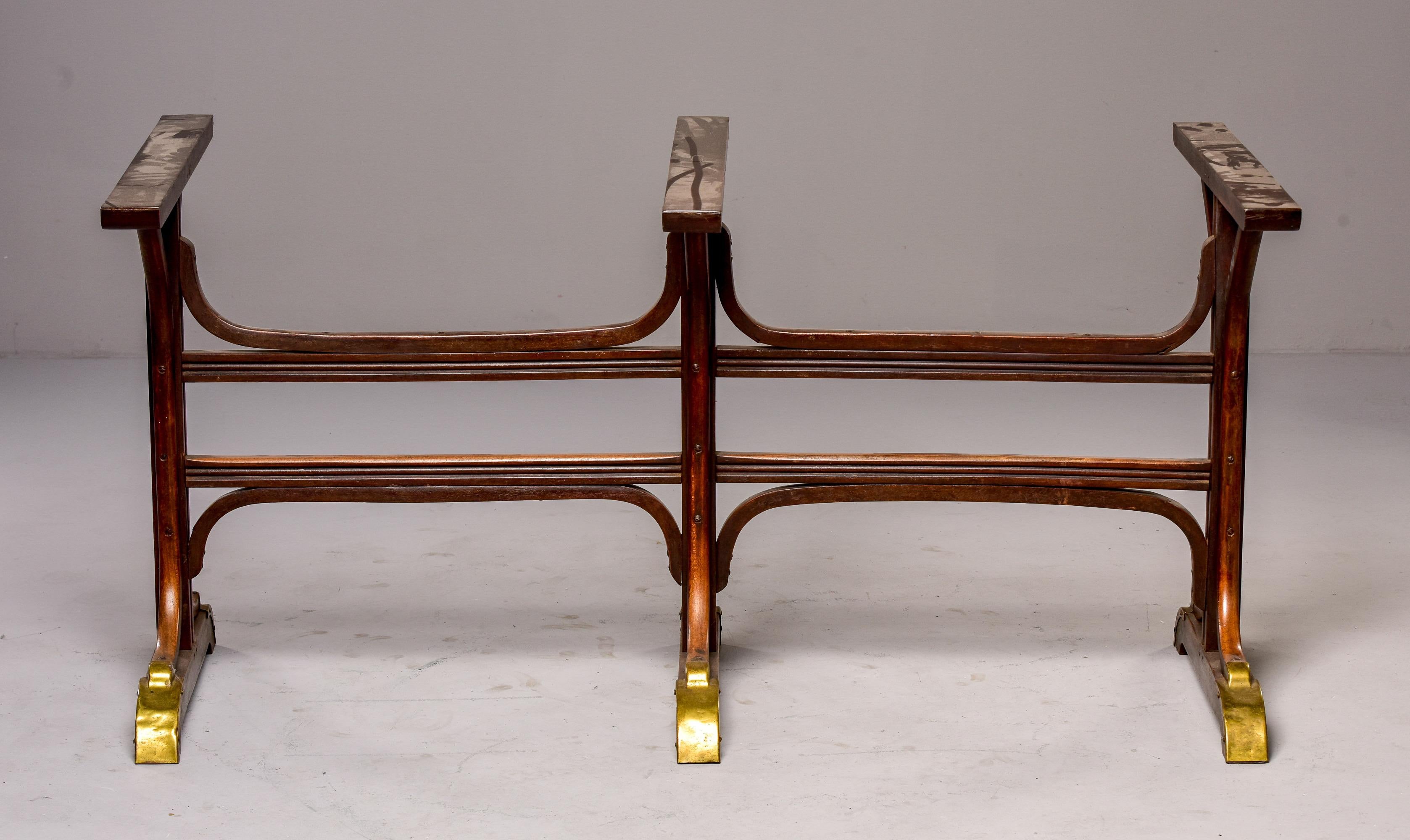 Circa 1890s bentwood pub table with brass fittings. Wood base has three trestle style supports with brass trim on feet, and bentwood supports. 

Measures: Base only: 28.5” high x 56.5” wide x 30” deep
Glass top: 72” long x 42” wide x .5”