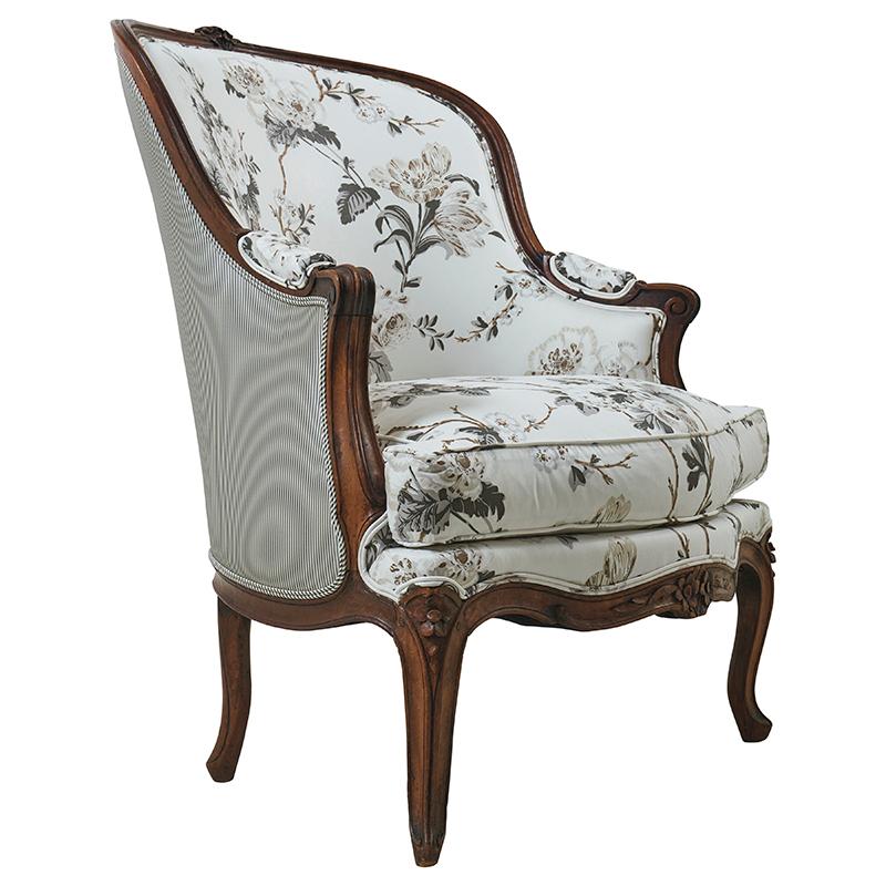 Late 19th Century French Bergère upholstered in Schumacher Betty Chintz (178401) fabric with Charee Silk Stripe (60920) on the back of the chair and arms.

Since Schumacher was founded in 1889, our family-owned company has been synonymous with