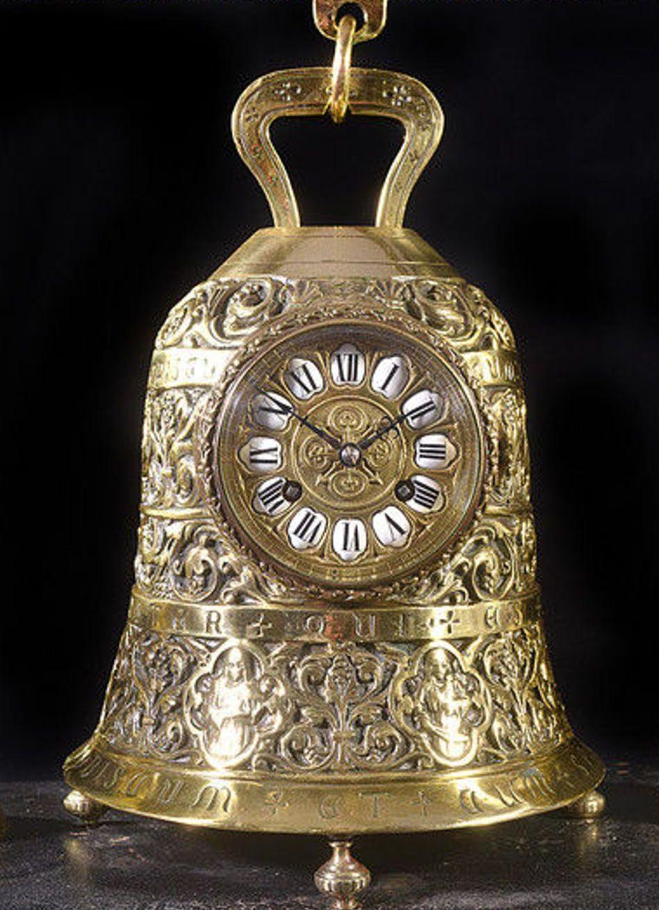 An unusual French late 19th century brass bell clock on its original stand.
The brass dial and chapter ring with enamel Roman numerals and winders for the eight day movement and chime.
This rare clock is inscribed 