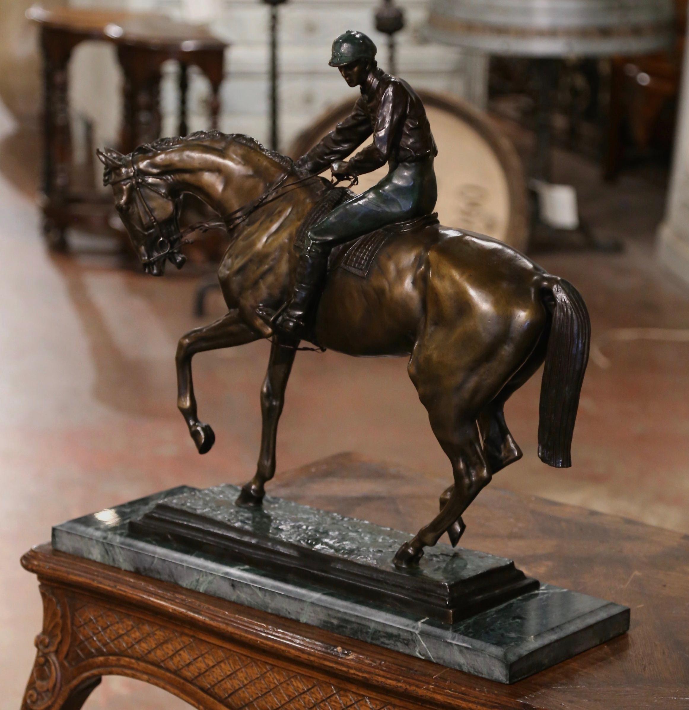 Decorate an office or study with this large antique bronze sculpture. Created in France circa 1880, and signed by French sculptor Isidore Bonheur, the sculpture is set on a green marble base, and features an elegant race horse mounted with his
