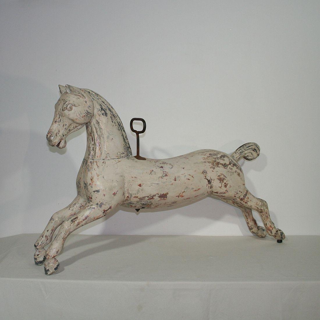 Beautiful carousel horse with traces of its original paint and stunning patina.
France, circa 1880-1900.
Weathered, small losses and antique repairs. More pictures are available on request.