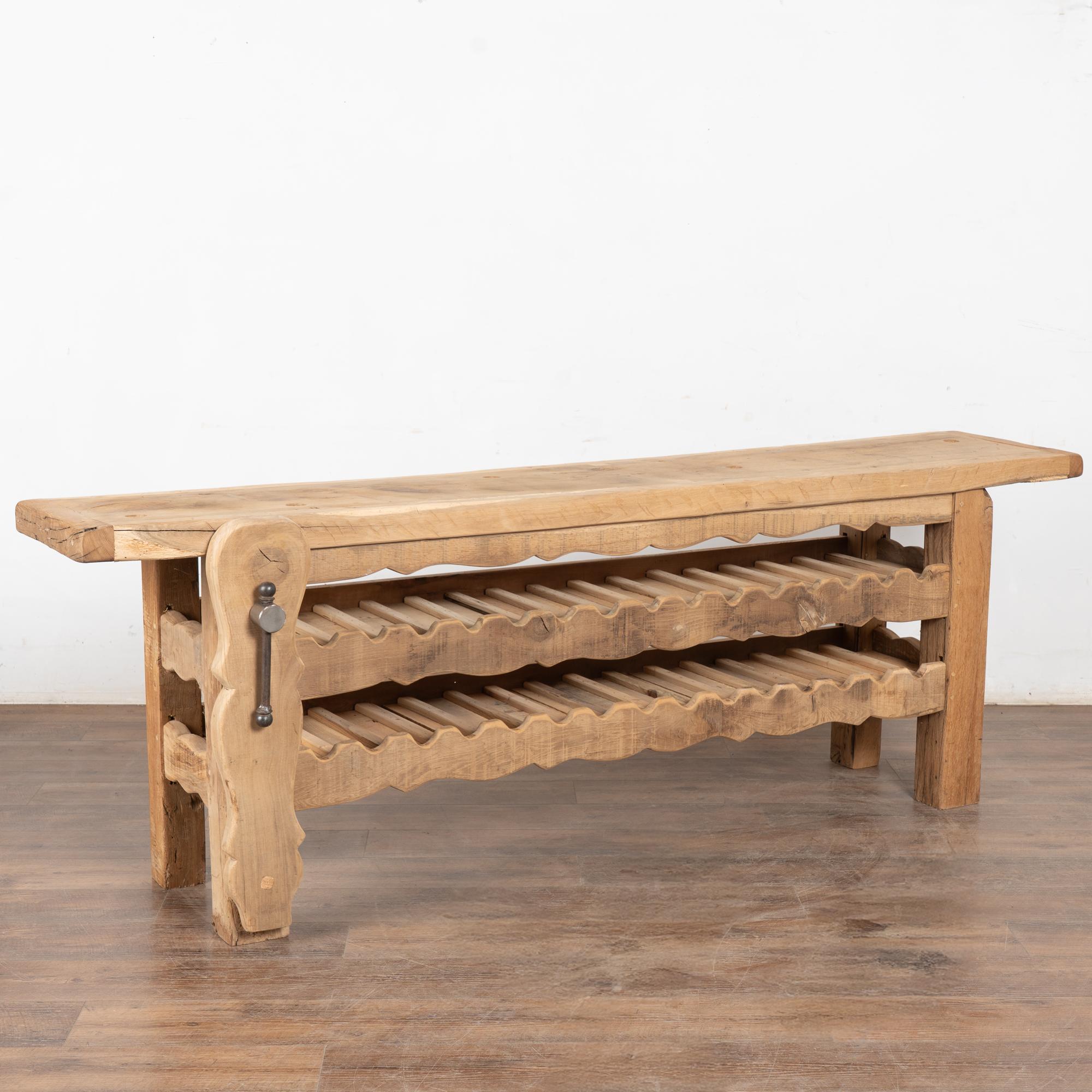 It is the years of constant use revealed in every ding, gouge, stain and scratch that enrich the character of this impressive carpenters' workbench from France.
lease examine the close up photos to appreciate the patina, joints and old hardware. It
