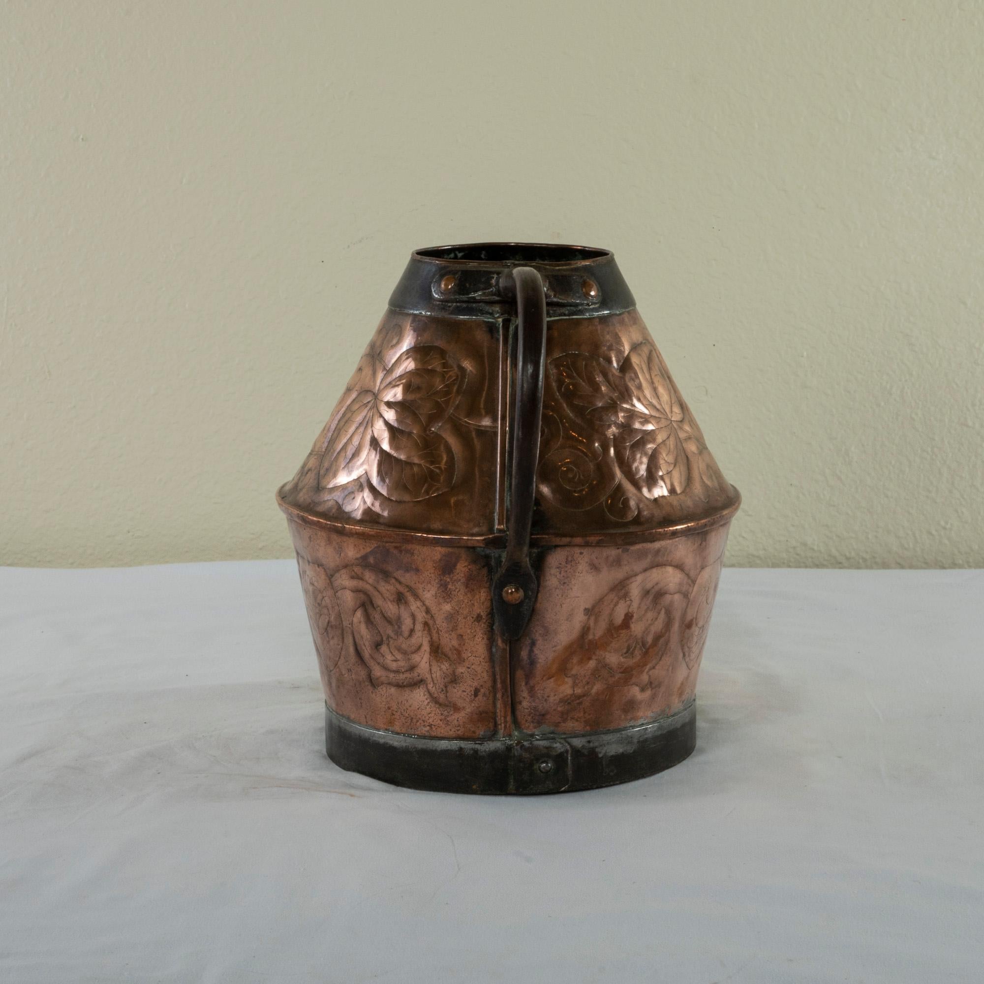 Late 19th Century French Copper Repousse Pitcher with Iron Straps and Handle In Good Condition For Sale In Fayetteville, AR