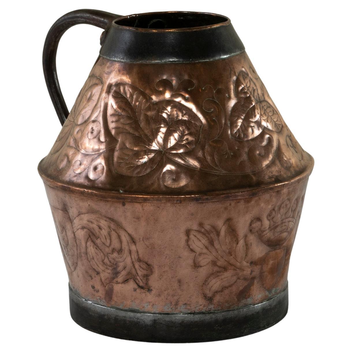 Late 19th Century French Copper Repousse Pitcher with Iron Straps and Handle For Sale