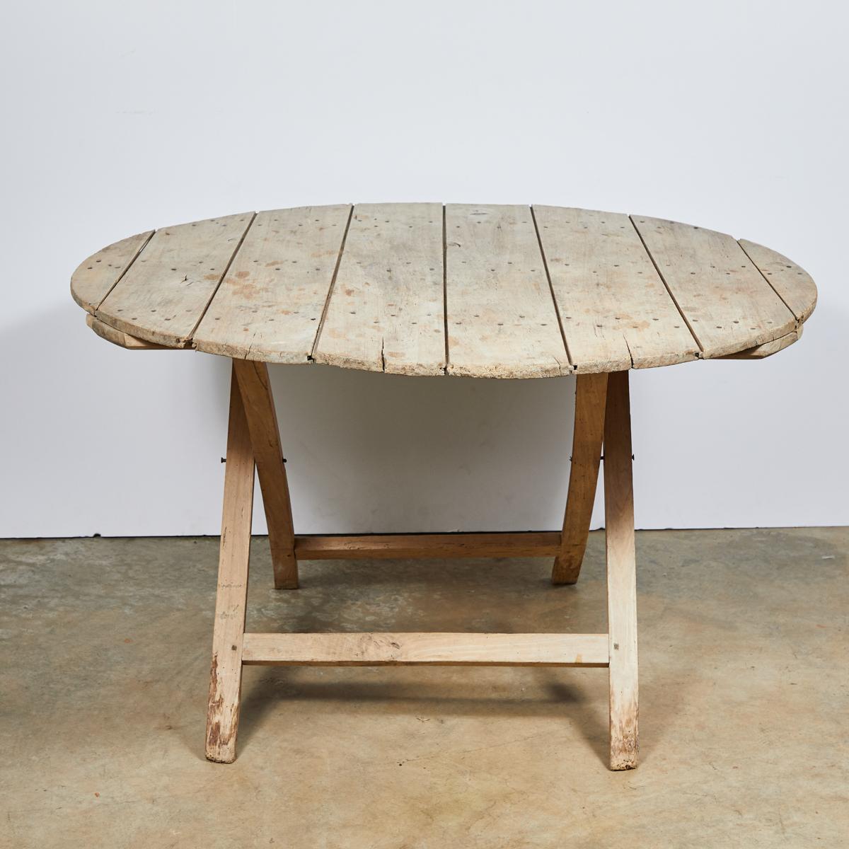 Late 19th-century table from the Champagne region of France. A beautiful light colored oak, this unfussy piece has a rustic patina, and would be lovely for both indoor and outdoor use.  

France, circa 1880

Dimensions: 49W x 49D x 29.5H
