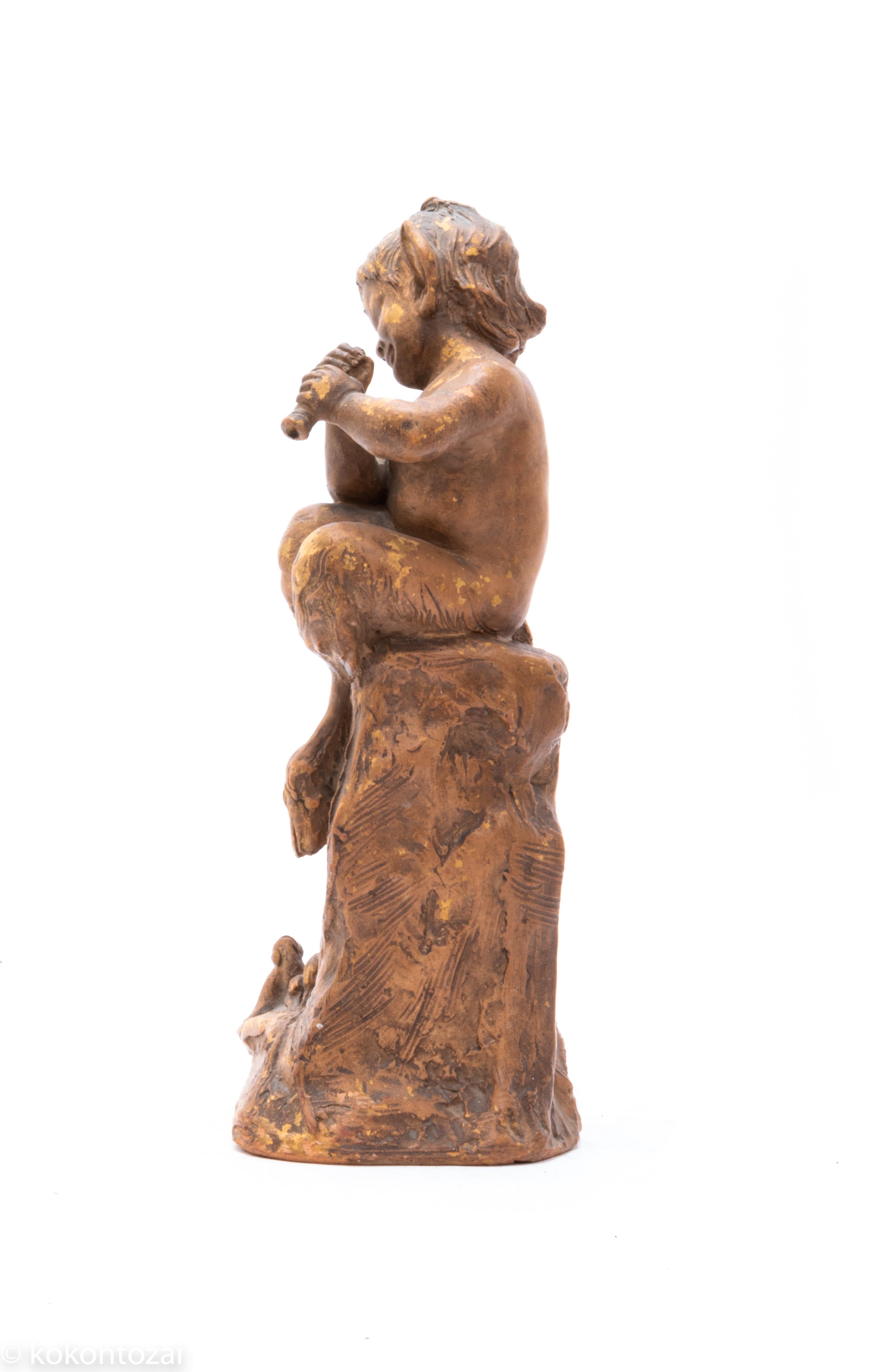 French Faun sculpture made in terracotta, and signed by 