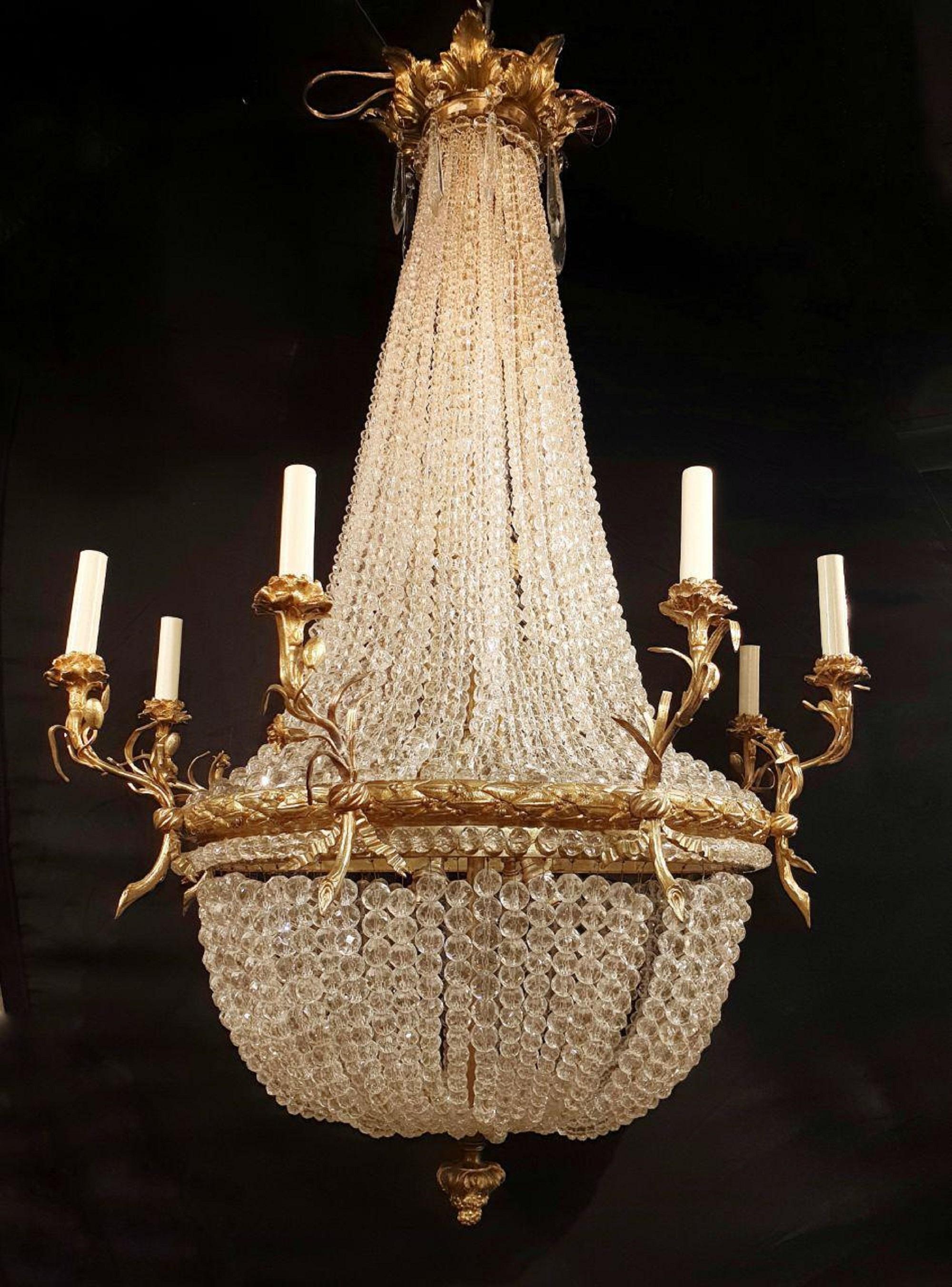 A late 19th century French gilt bronze and beaded crystals chandelier with 12 lights 